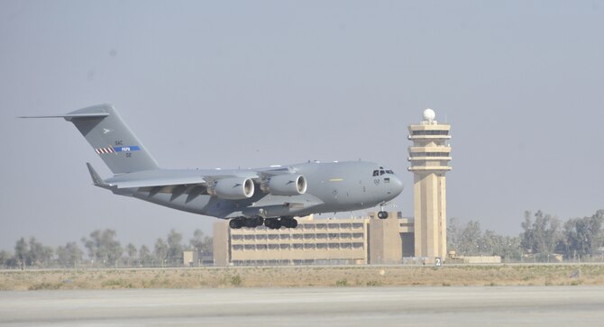 A C-17 from the multinational Heavy Airlift Wing based at Papa Air Base, Hungary makes the new unit's first landing at Baghdad International Airport. The airlift into Iraq was a first by the wing comprised of 12 member nations and facilitated the deployment for members of the NATO Training Mission-Iraq. The wing operates three C-17s and includes NATO member nations Bulgaria, Estonia, Hungary, Lithuania, the Netherlands, Norway, Poland, Romania, Slovenia and the U.S., as well as Partnership for Peace nations Finland and Sweden.