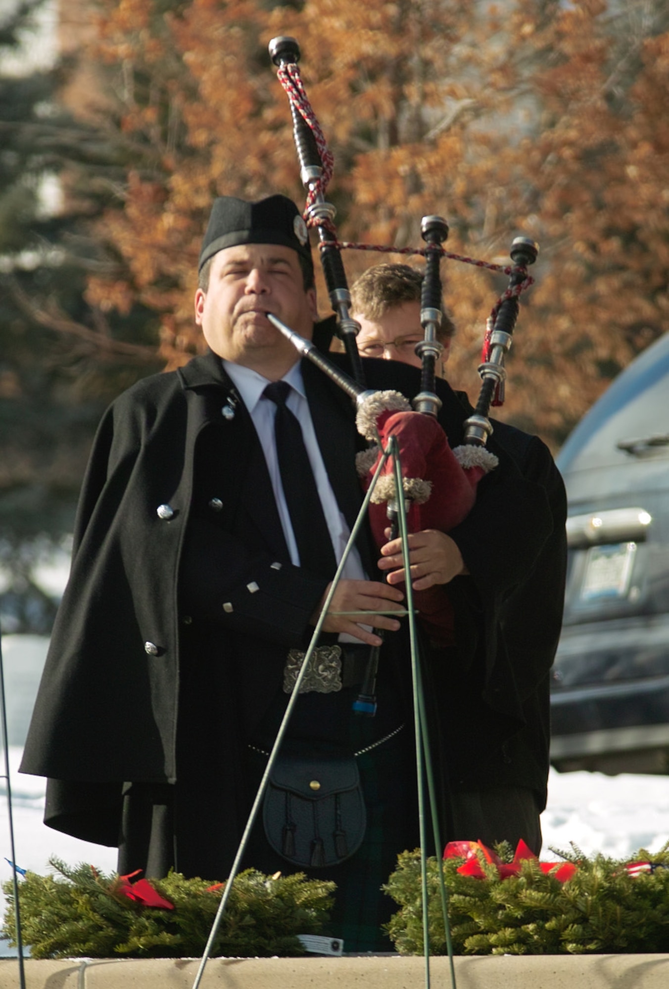 A bagpiper from the Scottish American Military Society plays for the fallen during the ceremony Dec. 12. SAMS members braved the 35-degree temperatures in traditional Scottish garb, including kilt, to honor veterans. (U.S. Air Force photo by Master Sgt. Steven Clark)