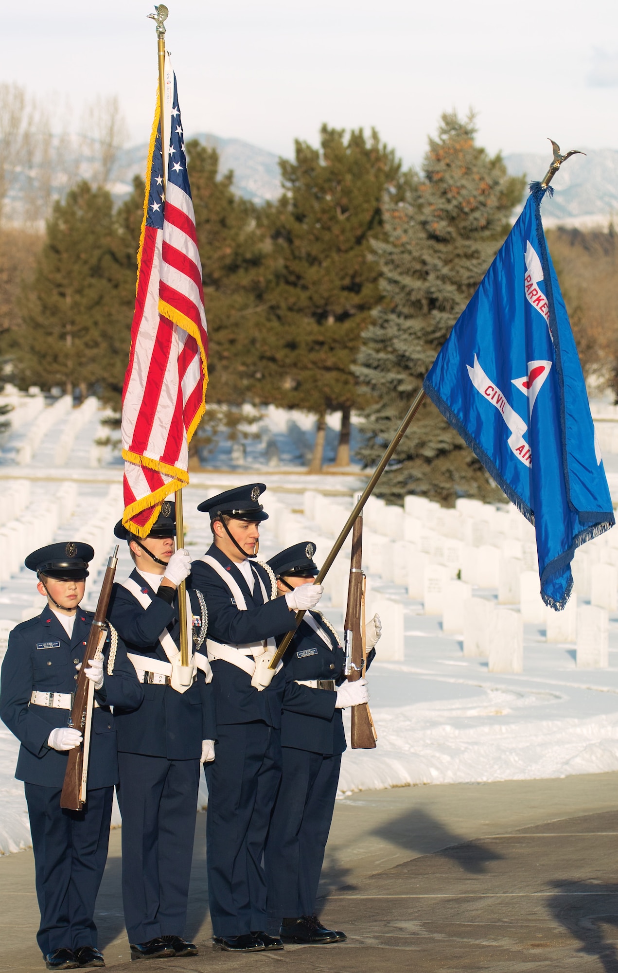 A Civil Air Patrol color guard presents arms during the national anthem at Wreaths Across America. (U.S. Air Force photo by Master Sgt. Steven clark)