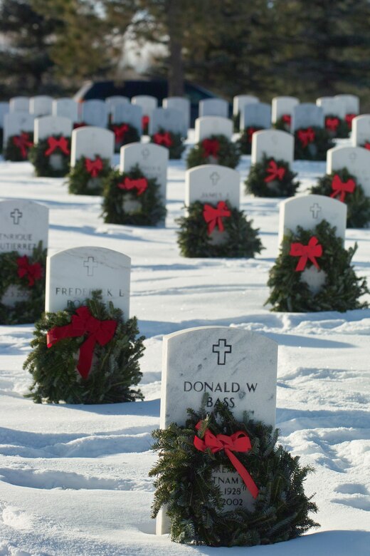 Wreaths adorn the graves of veterans during Wreaths Across America at Fort Logan National Cemetary in Littleton, Colo. Dec. 12. Eighty-seven volunteers from Buckley Air Force Base joined Civil Air Patrol members and volunteers from Schriever and Peterson Air Force Bases and the Denver Metropolitan Area for a day of honoring departed veterans. (U.S. Air Force photo by Master Sgt. Steven Clark)
