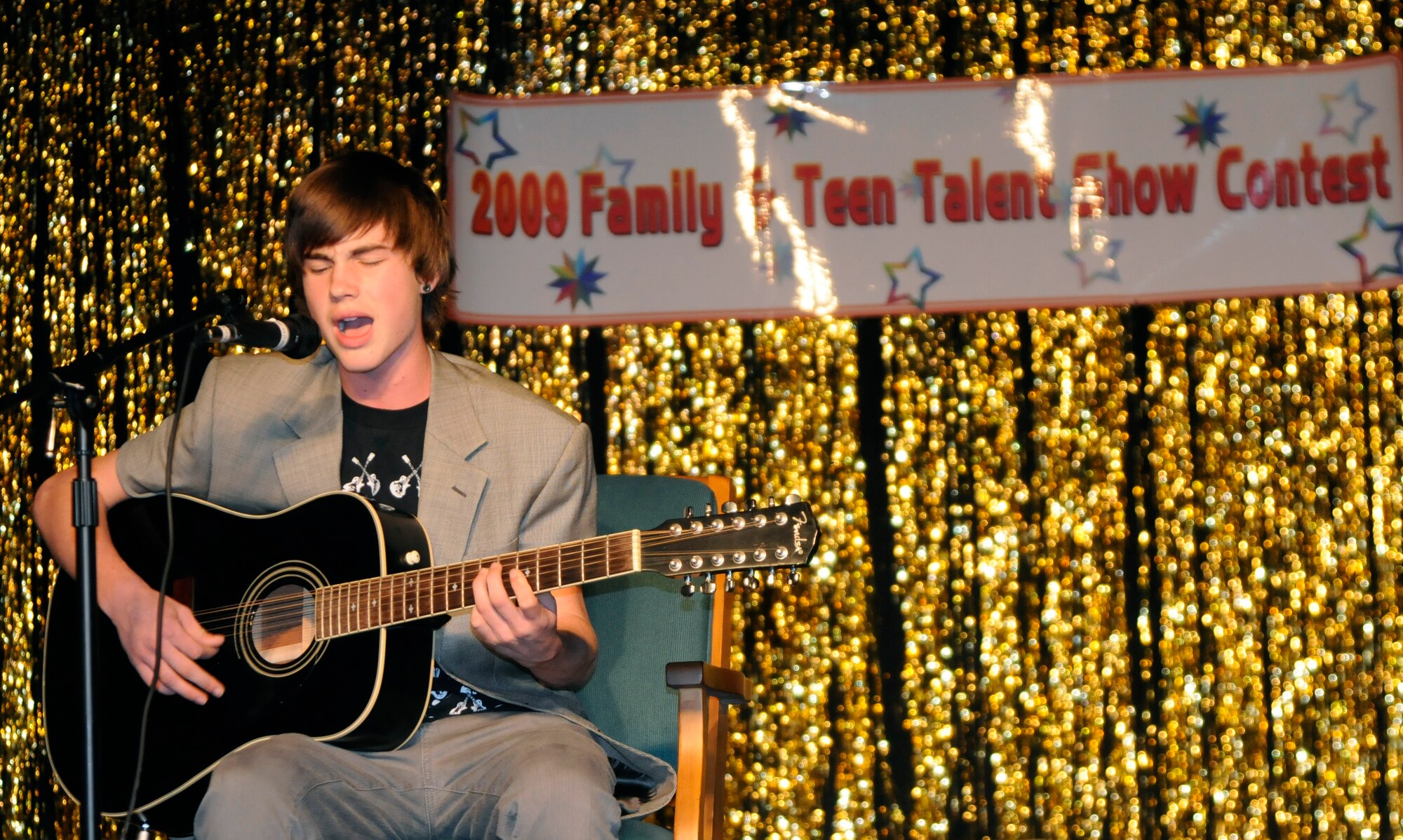 Keyton Daniels, son of Shannon Daniels, Incirlik Unit School teacher, performs “I’m yours” by Jason Mraz with some of his own lyrics added Thursday, Dec. 10, 2009, during the Family and Teen Talent Show at Incirlik’s Community Center. The participants were judged on their performance and showmanship and a winner from each category was selected. The winners then had a tape of their performance sent to the Air Force level for judging. (U.S. Air Force photo/Airman 1st Class Amber Ashcraft)