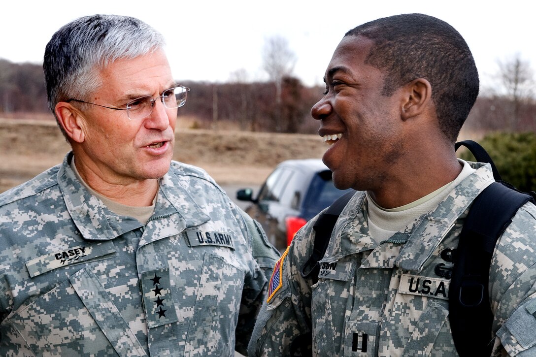 U.S. Army Chief of Staff Gen. George W. Casey Jr., left, and U.S. Army Cpt. Johnson, right, talk at Camp Higashi-Chitose, Japan, Dec. 16, 2009.  Casey visited U.S. soldiers serving in Japan to thank them for their service and to wish them happy holidays.