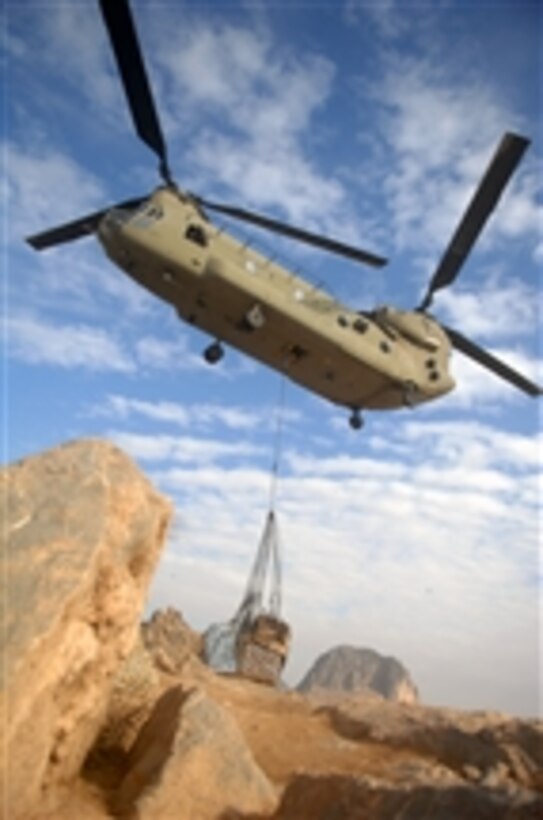 A U.S. Army CH-47 Chinook helicopter assigned to Task Force Talon, 82nd Combat Aviation Brigade resupplies Charlie Company, 1st Battalion, 17th Infantry Regiment at its outpost in Baba Saheb Ghar, in the Arghandab River Valley section of the Kandahar province of Afghanistan on Dec. 12, 2009.  