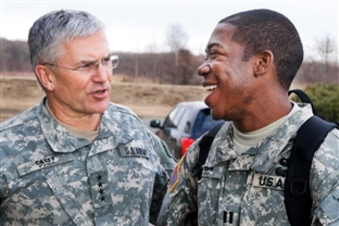 U.S. Army Chief of Staff Gen. George W. Casey Jr. talks with a U.S. soldier on Camp Higashi-Chitose, Japan, Dec. 16, 2009.  Casey visited U.S. soldiers in Japan to thank them for their service and to wish them happy holidays. 
