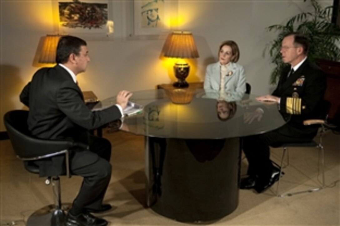 U.S. Ambassador to Pakistan Anne Patterson and U.S. Navy Adm. Mike Mullen, chairman of the Joint Chiefs of Staff, are interviewed by Pakistani Dunya TV host Moeed Pizada in Islamabad, Pakistan, Dec. 16, 2009.