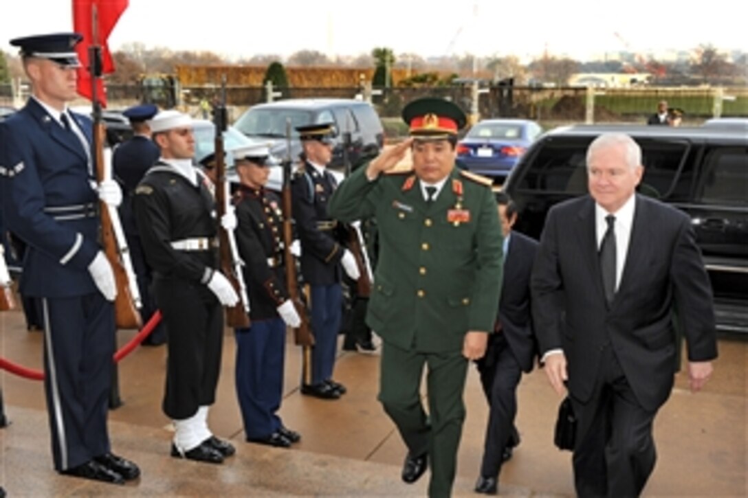 Secretary of Defense Robert M. Gates (right) escorts Vietnamese Minister of National Defense Gen. Phung Quang Thanh through an honor cordon and into the Pentagon for security discussions on Dec. 15, 2009.  
