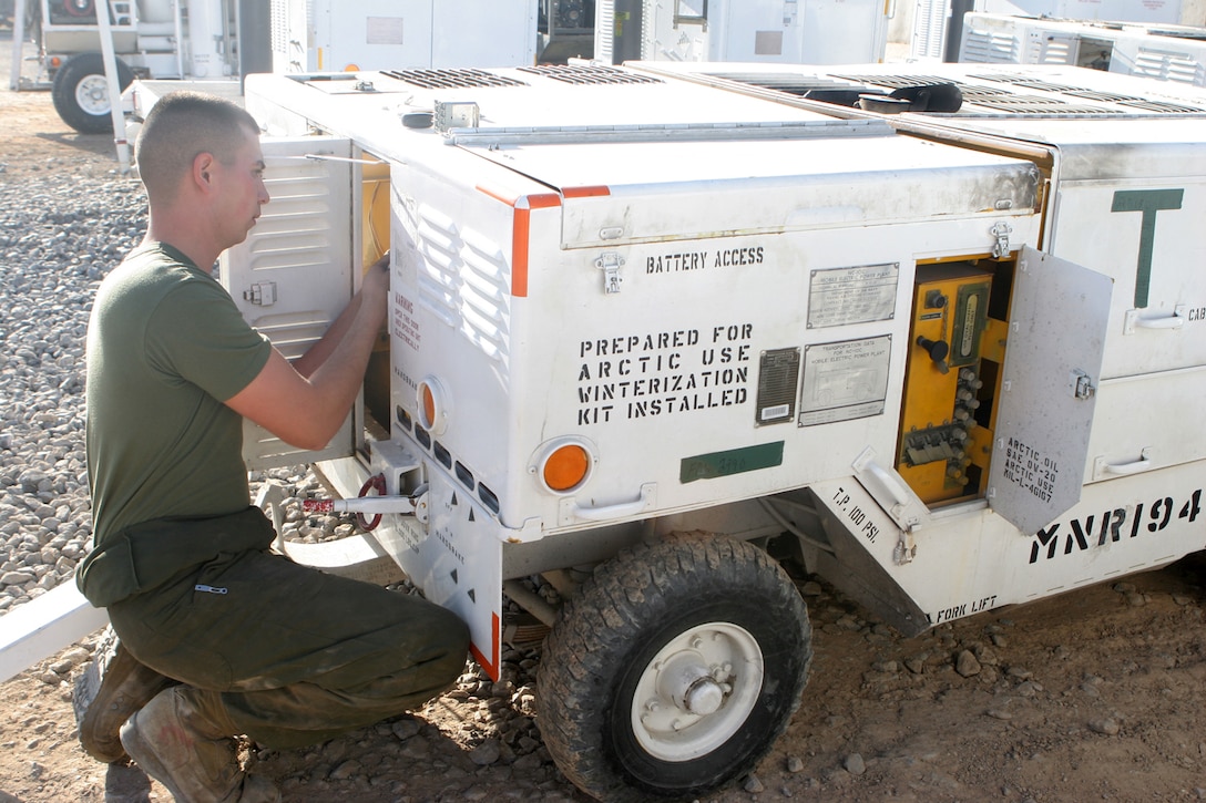Lance Cpl. Eduardo Thompson, a ground support equipment mechanic with Marine Aviation Logistics Squadron 40, Marine Aircraft Group 40, Marine Expeditionary Brigade-Afghanistan, replaces the relay on a generator Dec. 17, 2009, in Afghanistan.  MALS 40 received the 2010 Phoenix Award, the Department of Defense’s highest maintenence award, at the DOD’s maintenance symposium in Tampa, Fla., Nov. 17.