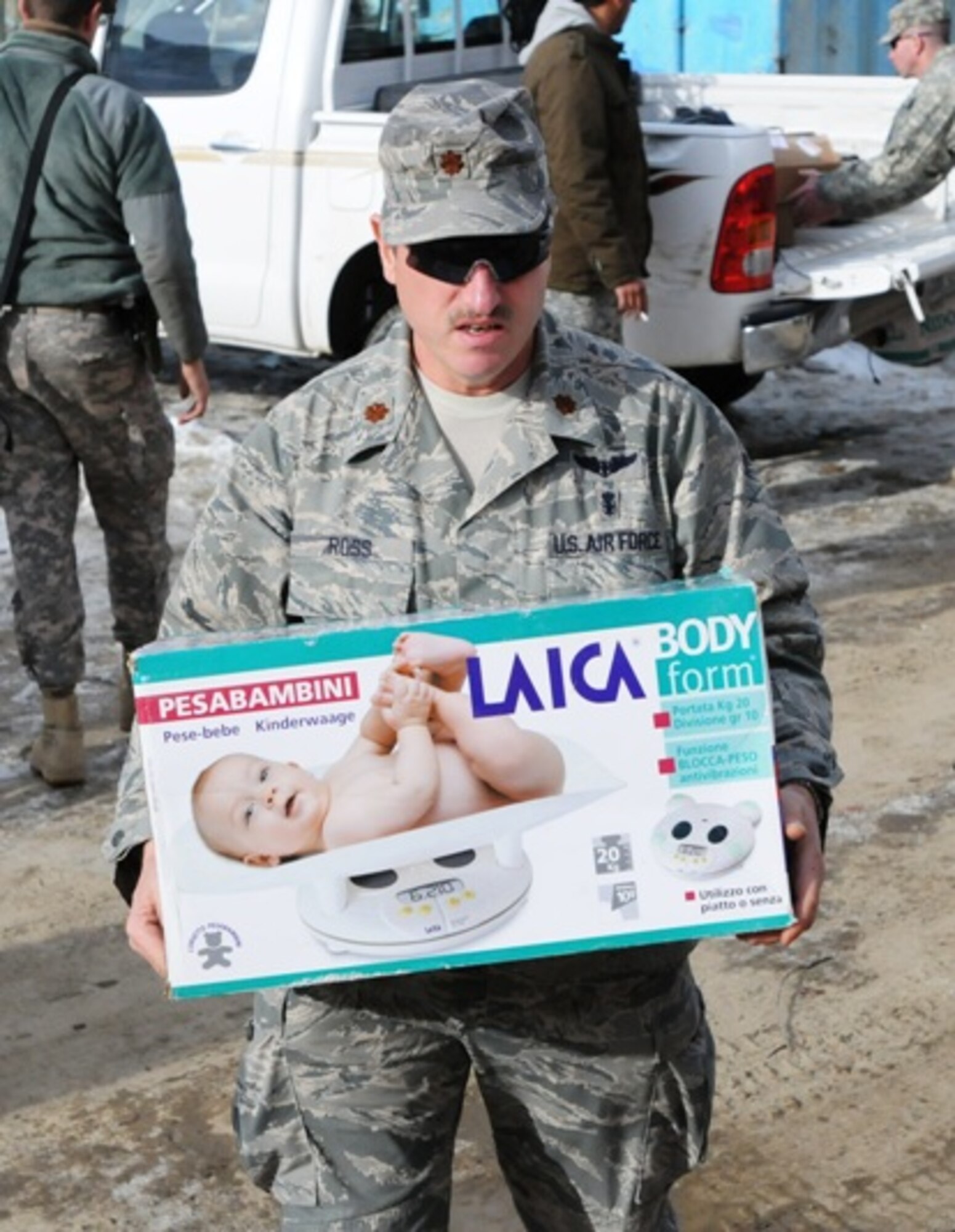 PANJSHIR PROVINCE, Afghanistan – Panjshir Provincial Reconstruction Team’s Chief Medical Officer, Air Force Maj. Gordon Ross, delivers a scale to the Strong Foods program site in the Dara district of Panjshir province, Afghanistan Dec, 14. The Strong Foods program is an initiative to combat the high infant mortality rate in Afghanistan due to malnutrition. (Air Force photo/Capt. John T. Stamm)