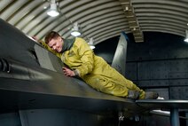 KUNSAN AIR BASE, Republic of Korea -- Staff Sgt. Nathaniel Olive, 35th Aircraft Maintenance Unit, reattaches a panel onto an F-16 Fighting Falcon Dec. 18. Sergeant Olive was buttoning up the F-16 after performing engine checks. (U.S. Air Force photo by/Senior Airman Jonathan Steffen)