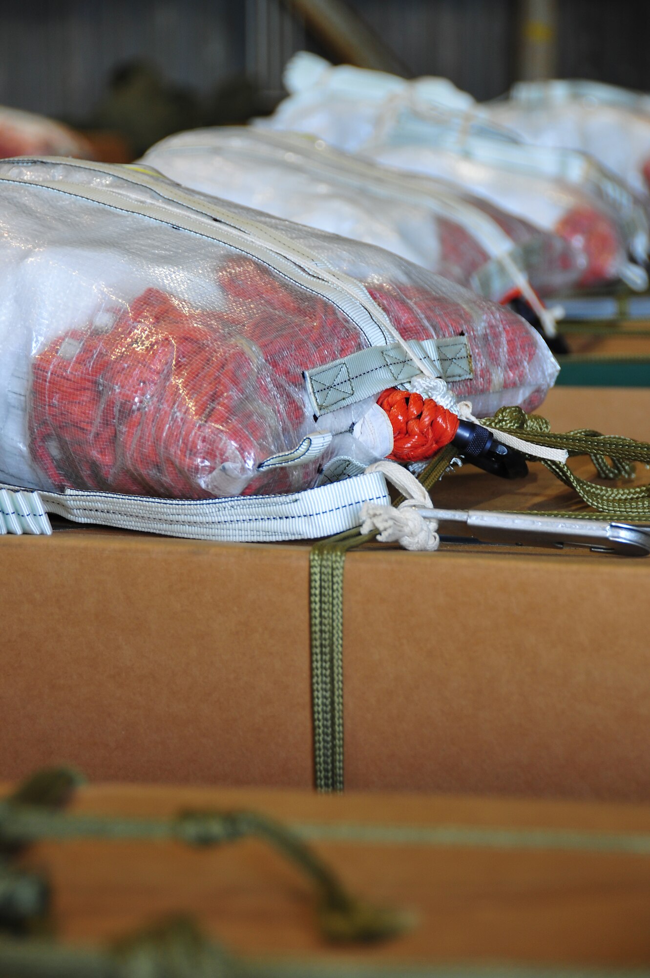 ANDERSEN AIR FORCE BASE, Guam ? The 36th Airlift Squadron used the low cost aerial delivery system for the first time during Operation Christmas Drop. This was the first step in validating the new capability.  The 374th Logistics Readiness Squadron personnel rigged 57 bundles to support 12 sorties, to 51 islands covering a geographic area of more than 1.8 million square miles in support of Operation Christmas Drop. (U.S. Air Force photo/Tech. Sgt. Kimberly Spinner)