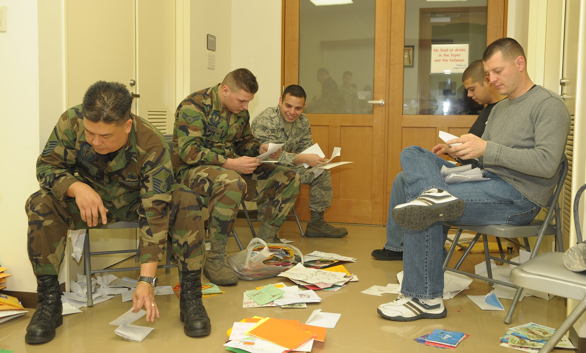 YOKOTA AIR BASE, Japan -- Volunteers sort and package more than 15,000 holiday cards Dec. 17 at the main chapel during the American Red Cross' "Holiday Mail for Heroes" campaign. (U.S. Air Force photo/Airman 1st Class Sean Martin)