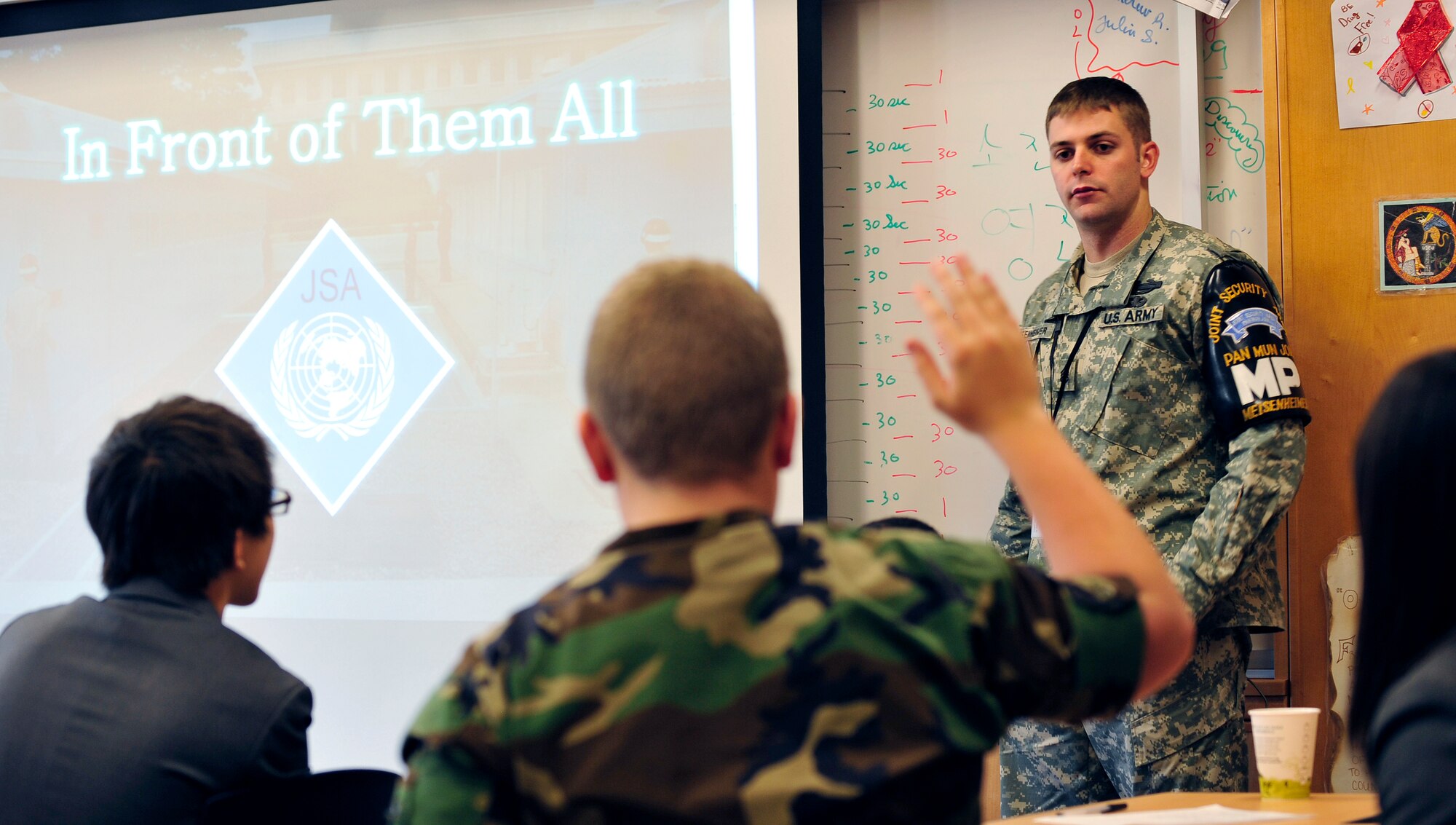 Army Staff Sgt. James Meisenheimer gives an 8th grade journalism class at
Osan Middle School a briefing on the history and operations of the joint
security area and demilitarized zone between North and South Korea Dec. 16.
Sergeant Meisenheimer is the security escort non-commissioned officer in
charge for the United Nations Command Security Battalion-Joint Security
Area. (U.S. Air Force photo/Staff Sgt. Brian Ferguson)
