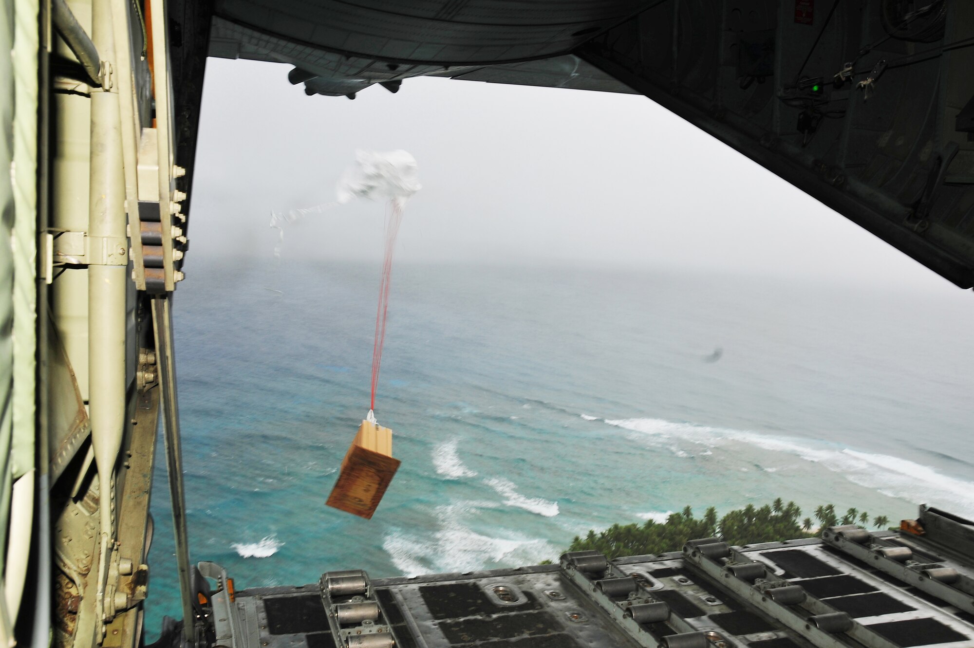 A bundle of donated goods heads for a Chuuk island during Operation Christmas Drop Dec. 16, 2009.  (U.S. Air Force photo/Tech. Sgt. Kimberly Spinner)