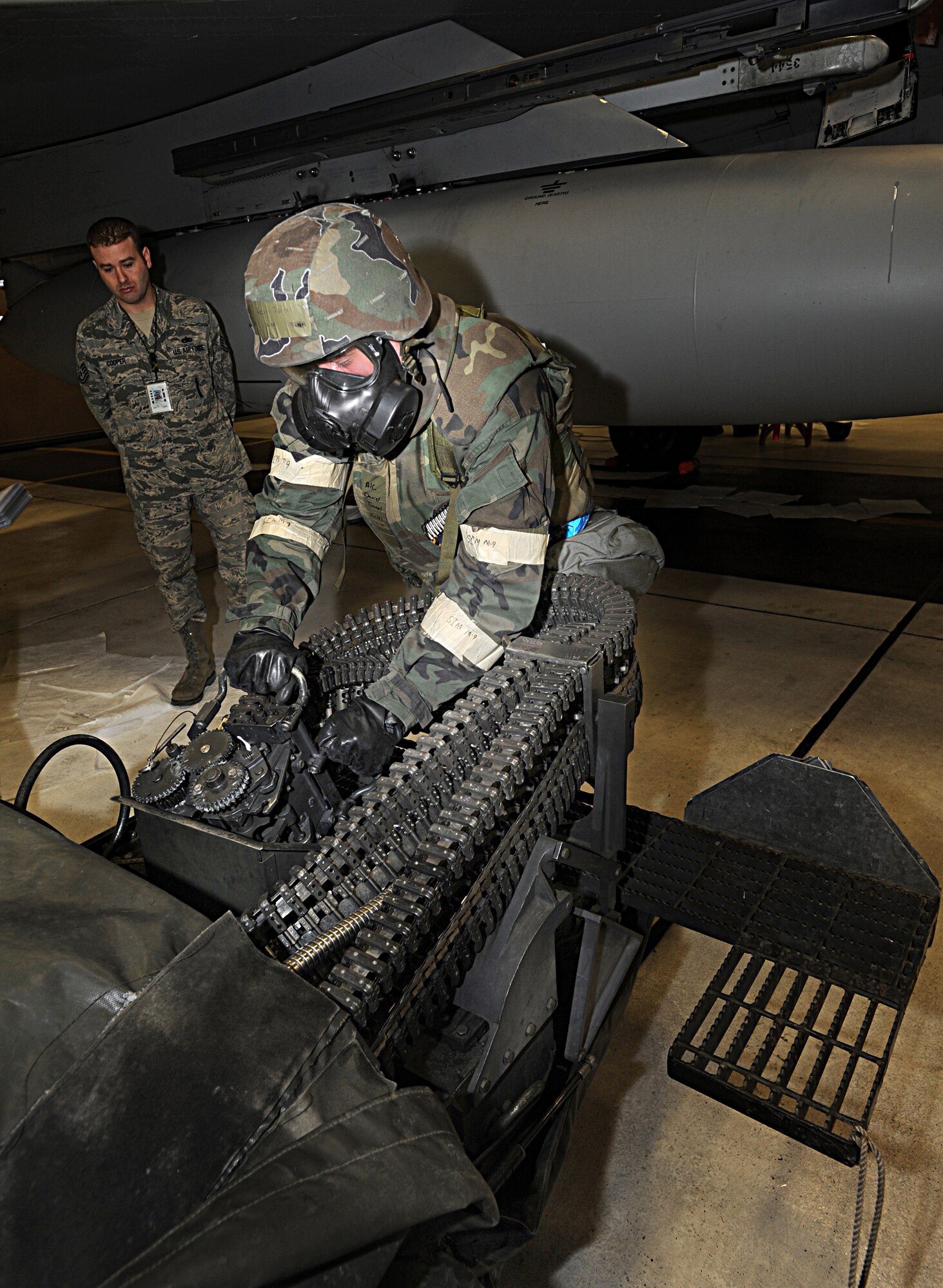 ELMENDORF AIR FORCE BASE, Alaska -- Airman 1st Class Daniel Tinnel, 19 Aircraft Maintenance Unit prepares the Universal Ammunition Loading System for loading to F-15 Dec. 11. The load crew competition was performed in Mission Oriented Protective Posture gear for the first time on Elmendorf AFB. (U.S. Air Force photo/Airman 1st Class Kristin High)