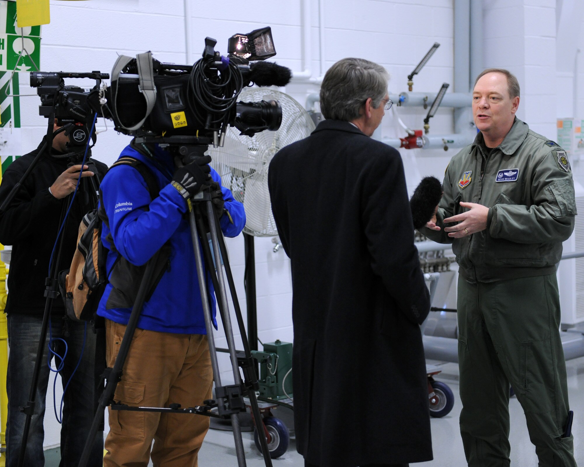 NY Air National Guard 174th Fighter Wing Commander, US Air Force Col. Kevin W. Bradley, explains the operation of the MQ-9 Reaper Remotely Piloted Aircraft at Hancock Field in Syracuse, NY on 17 Dec. 2009. The media were invited to observe MQ-9 operations at the 174th Fighter Wing. (US Air Force photo by Tech. Sgt. Jeremy M. Call/Released)