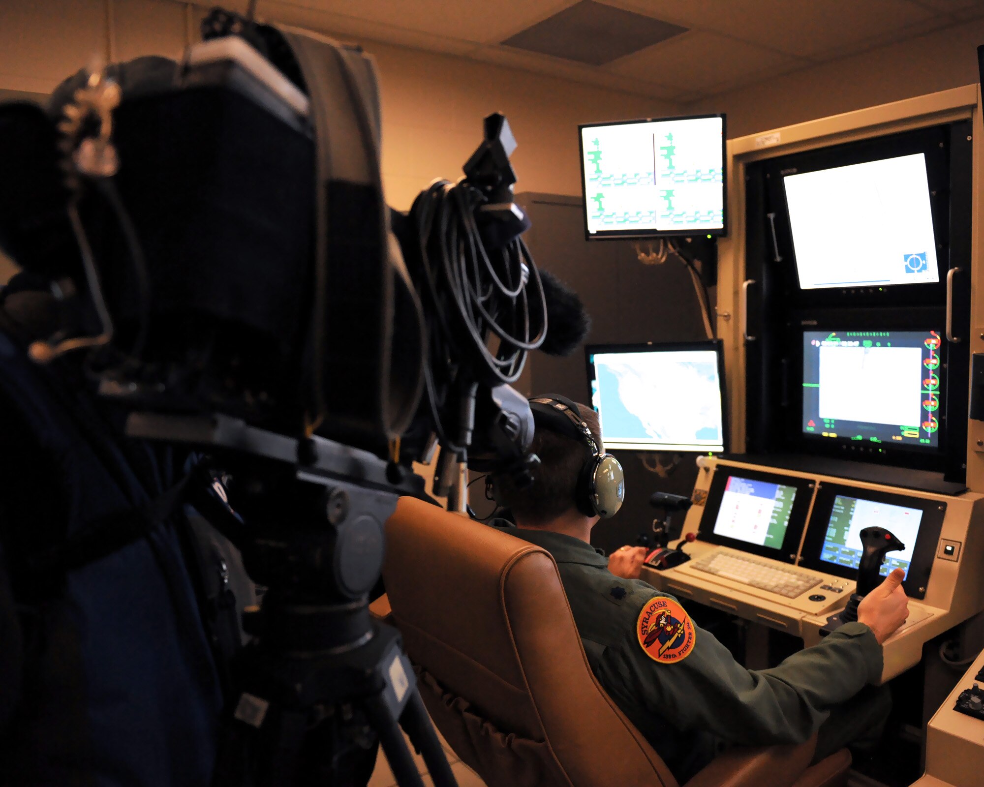 US Air Force Lt. Col. Mike displays MQ-9 Reaper Remotely Piloted Aircraft control for local media at Hancock Field in Syracuse, NY on 17 Dec. 2009. The media were invited to observe MQ-9 operations at the 174th Fighter Wing. (US Air Force photo by Tech. Sgt. Jeremy M. Call/Released)