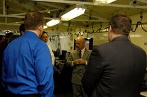 HANSCOM AIR FORCE BASE, Mass. -- Brian Welden of Fenwick Technologies talks with other participants,including Paul Kim of MITRE (facing), during a two-day Technical Exchange Meeting held here Dec. 9 and 10.  The exchange allowed Electronic Systems Center officials and contractor participants to exchange information about and demonstrate six "Net-Centric Path-Finder" technologies.  (US Air Force Photo by Mark Herlihy)
