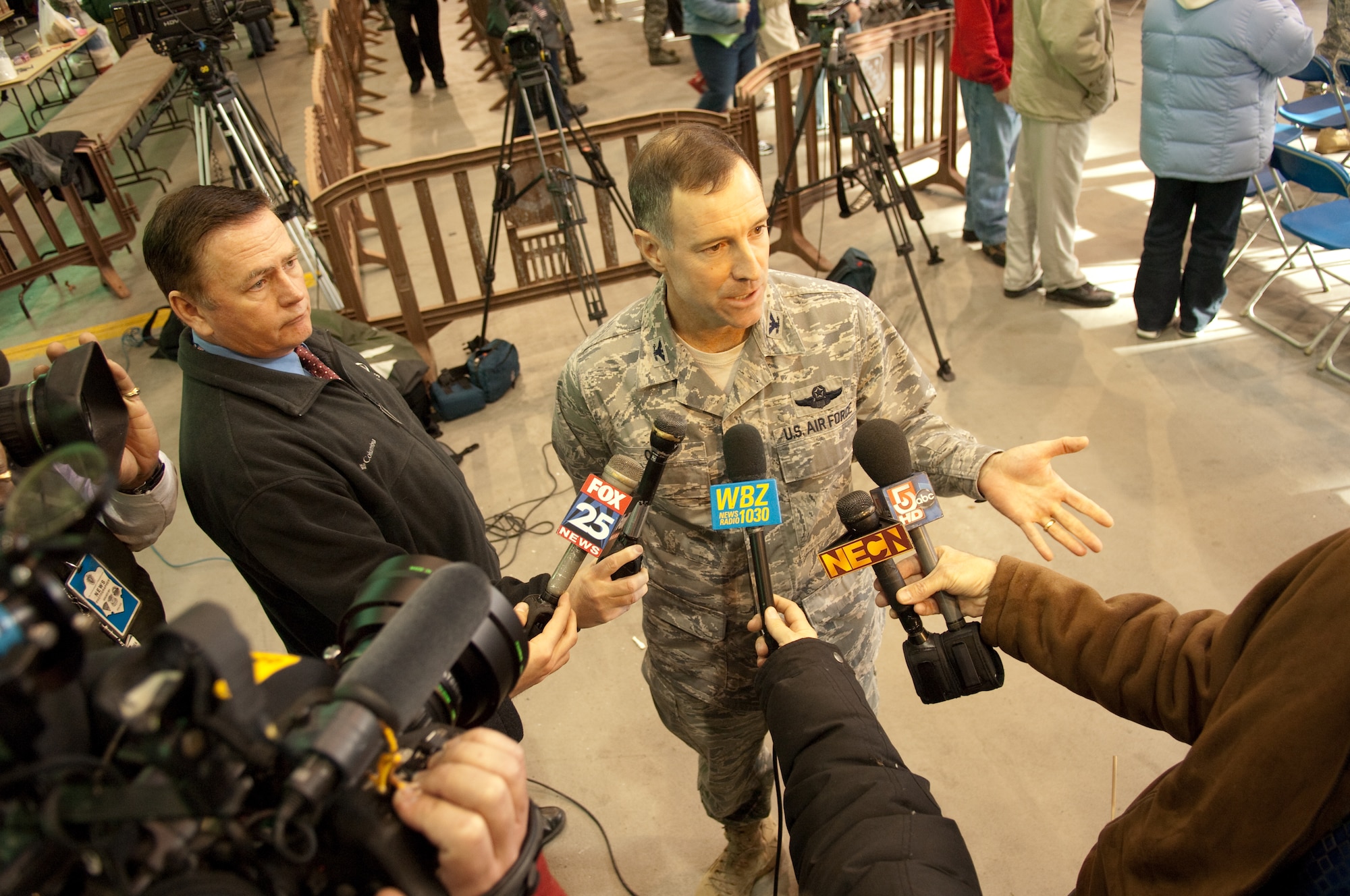 HANSCOM AIR FORCE BASE, Mass. - Col. Dave Orr, 66th Air Base Wing commander, addresses members of the local Boston and regional media Dec. 11 about the importance of honoring Airmen returning from deployments and their families. Hanscom hosted a Heroes Homecoming event where the base and local community welcomed nearly 30 Airmen back from their deployments. The event hosted guests from the Hanscom, local and Boston communities, including Air Force Materiel Command and Hanscom senior leadership, New England Patriots hall of famer John Hannah and other distinguished guests at the Hanscom Aero Club. (U.S. Air Force Photo by Rick Berry)