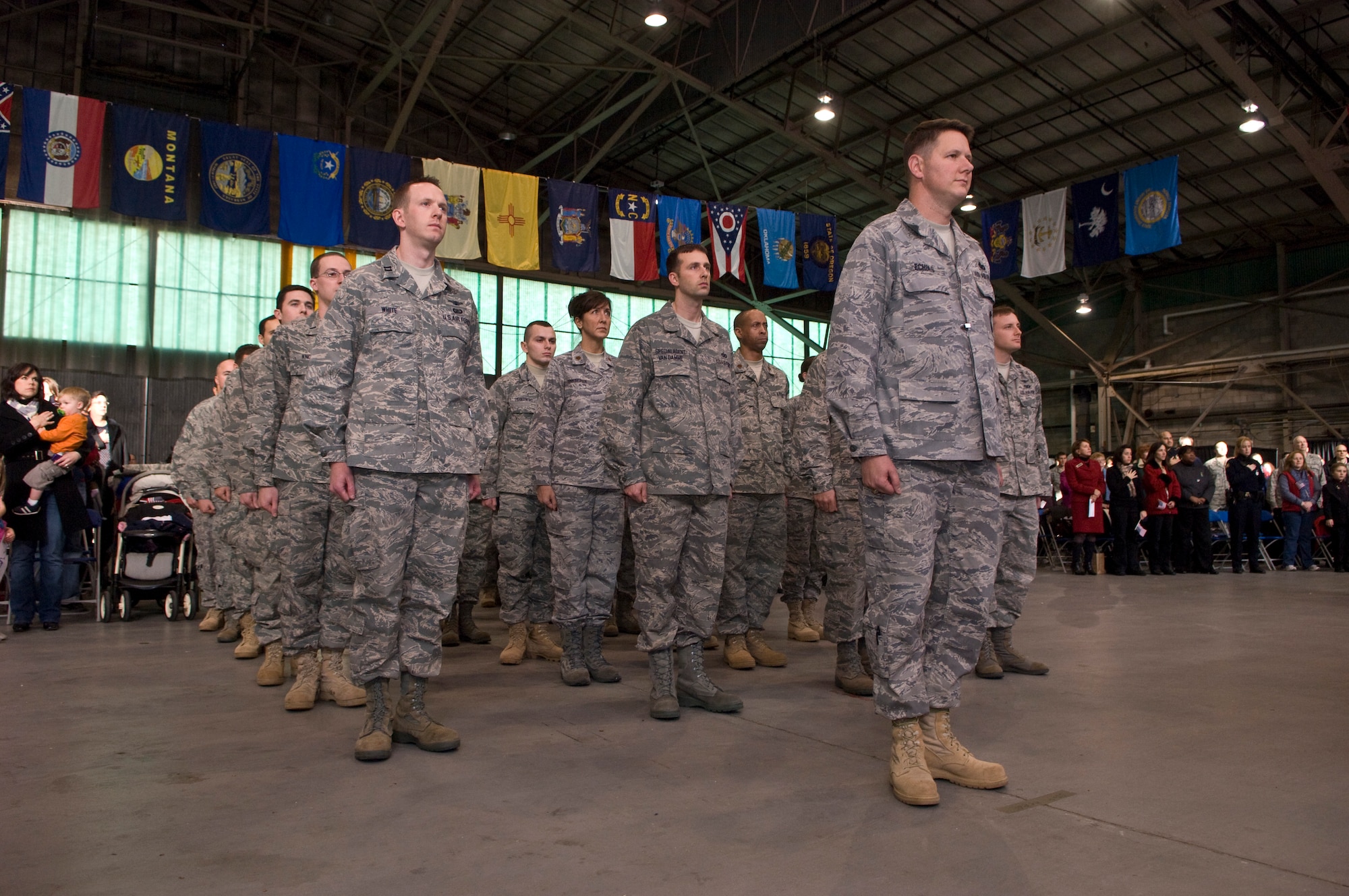 HANSCOM AIR FORCE BASE, Mass. - Lt. Col. Chris Echols, 66th Security Forces Squadron commander, stands at attention in command of a formation of Airmen returning from deployments over the past six months during the Heroes Homecoming reception at Hanscom Dec. 11. The event honored nearly 30 Airmen and their families for the sacrifices they have made and hosted guests from the Hanscom, local and Boston communities, including Air Force Materiel Command and Hanscom senior leadership, New England Patriots hall of famer John Hannah and other distinguished guests at the Hanscom Aero Club. (U.S. Air Force Photo by Mark Herlihy)