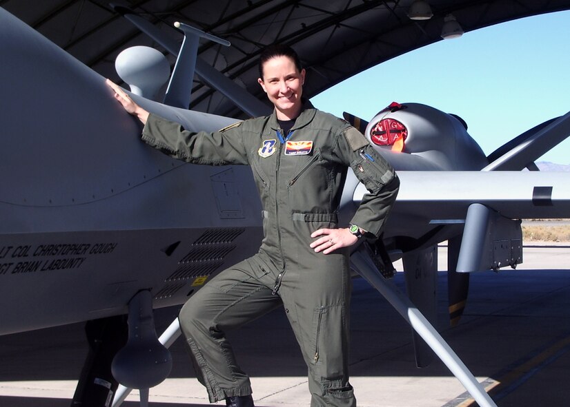 Maj. Tammy Barlette gets familiar with an MQ-9 Reaper at Nellis Air Force Base, Nev. She is the first and only Air National Guard Predator pilot to graduate from the Air Force’s Weapons Instructor Course. She and three active duty Remotely Piloted Aircraft (RPA) operators were the first to attend the rigorous weapons and tactics training program. (Courtesy photo)