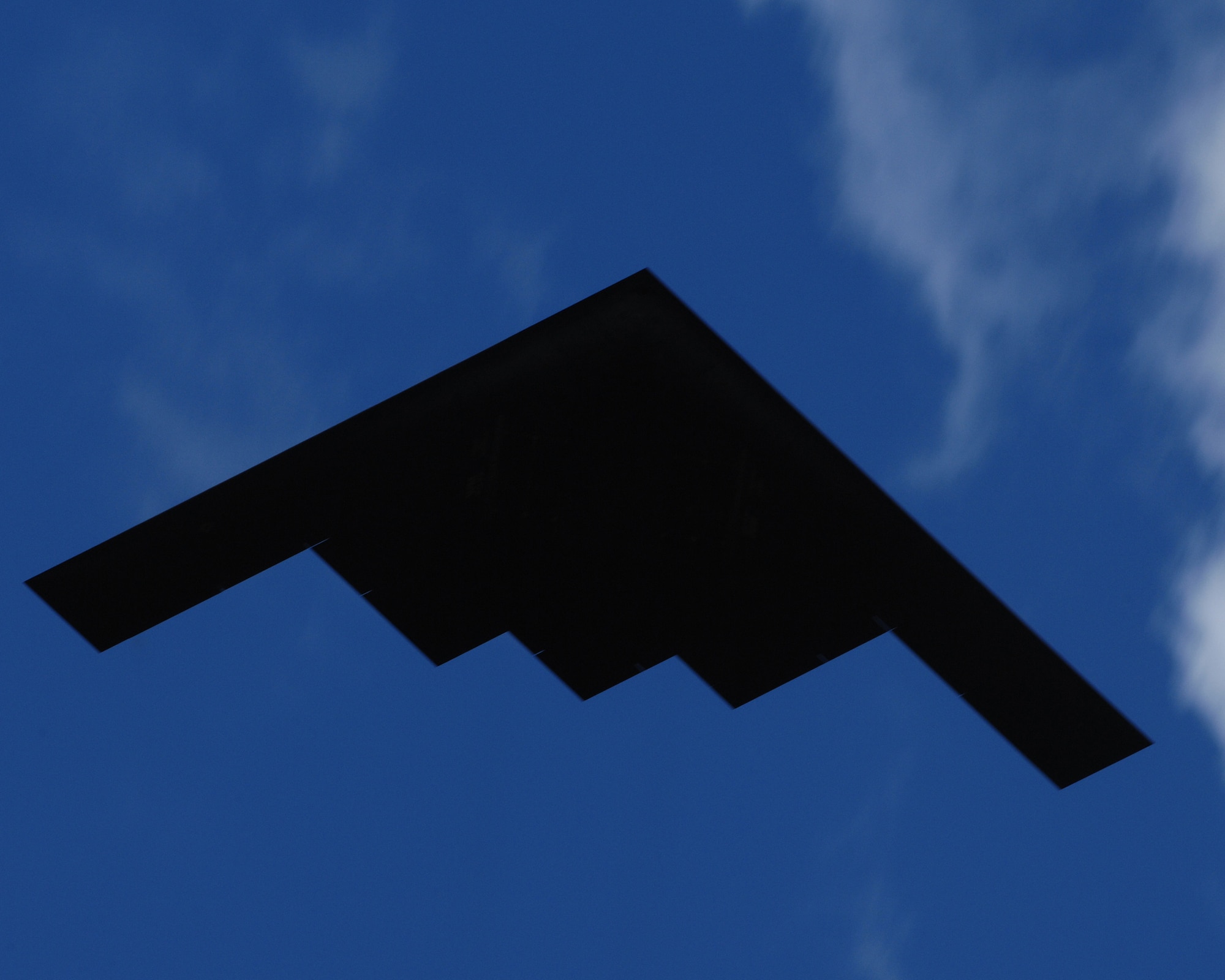 A B-2 Spirit flies over Whiteman during a regular training mission. Nineteen B-2 Spirit aircrafts are assigned to the 509th Bomb Wing. (U.S. Air Force photo/Airman 1st Class Carlin Leslie) 