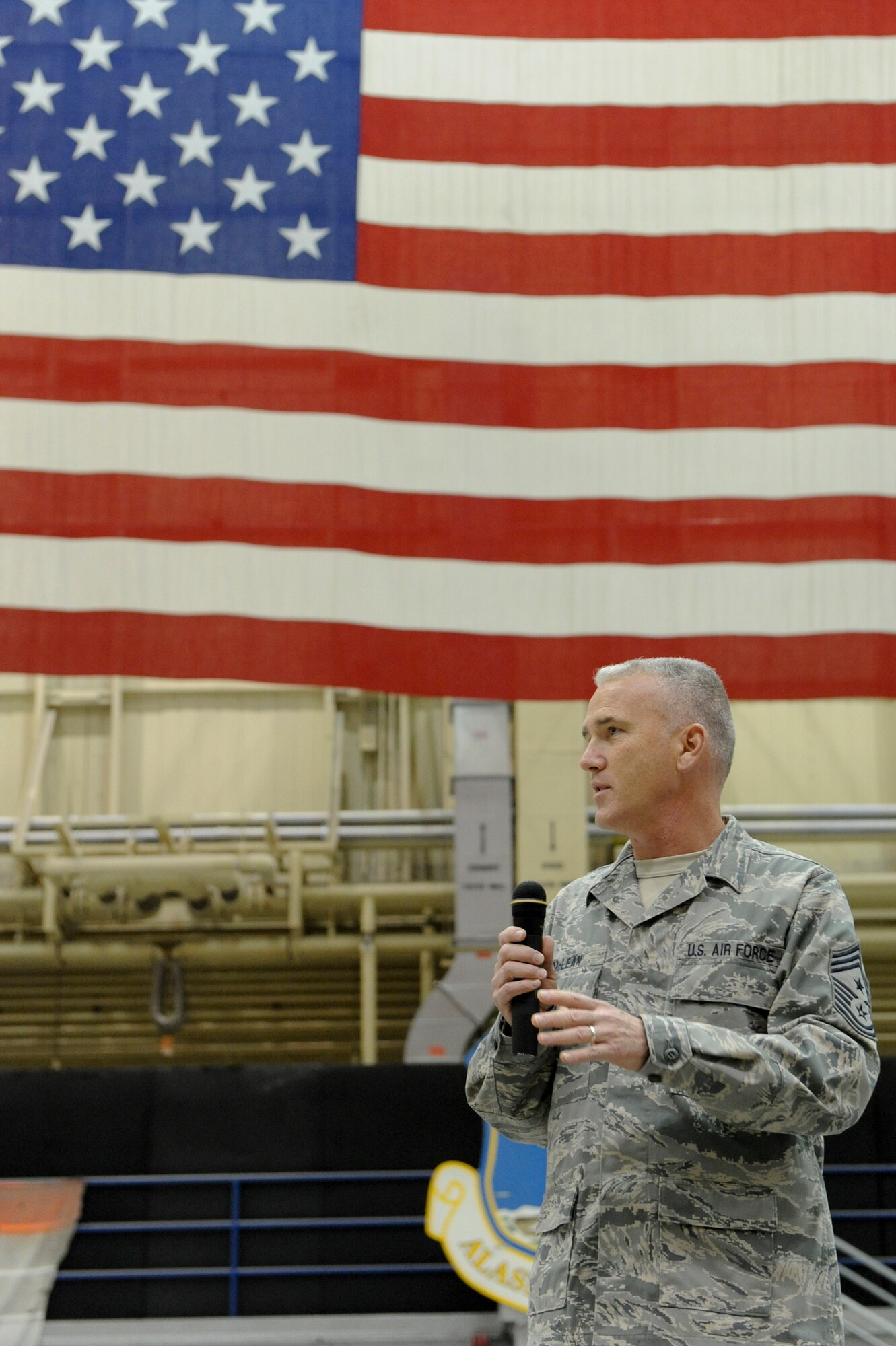ELMENDORF AIR FORCE BASE -- Pacific Air Forces Command Chief Master Sgt. Brooke McLean talks to Airmen of the 3rd Wing during an “Airmen’s Call” here, Dec. 9, 2009. Chief McLean and Pacific Air Forces Commander Gen. Gary North toured base establishments and met with Airmen during the visit. The visit to Elmendorf Air Force Base was part of a tour of PACAF bases. (U.S. Air Force photo/ Staff Sgt. Joshua Garcia)