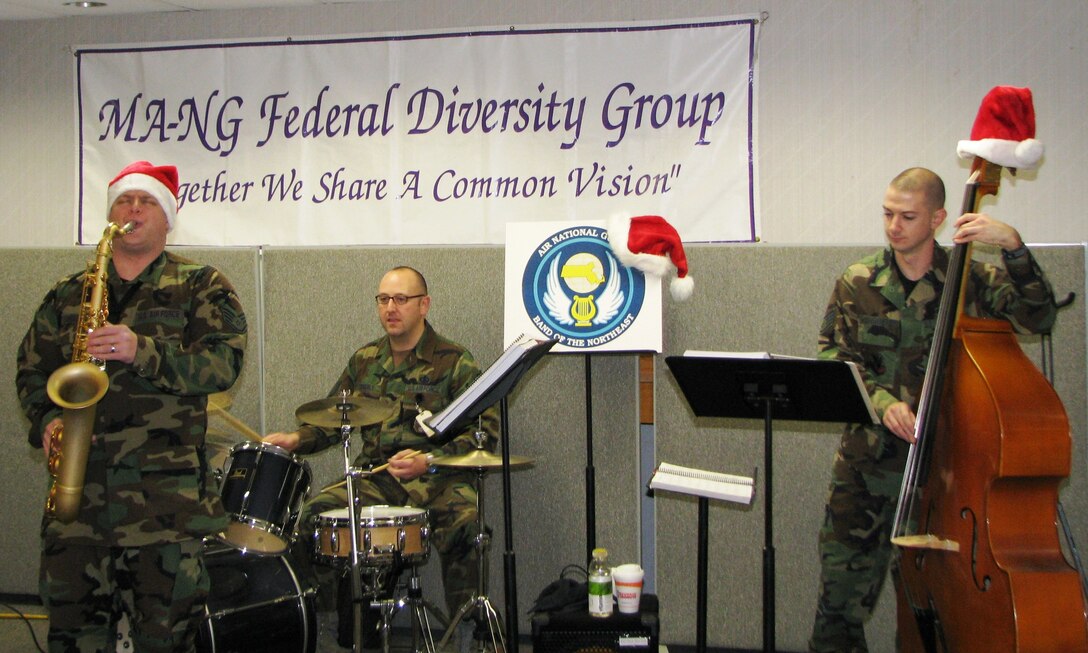 SSgt Chris Langellotti, MSgt Chuck Edgerly, and SSgt Pat Chambers entertain the men and women of the Massachusetts National Guard at the MA JFHQ Annual Holiday UTA Luncheon.  (Photo MA JFHQ/PA)