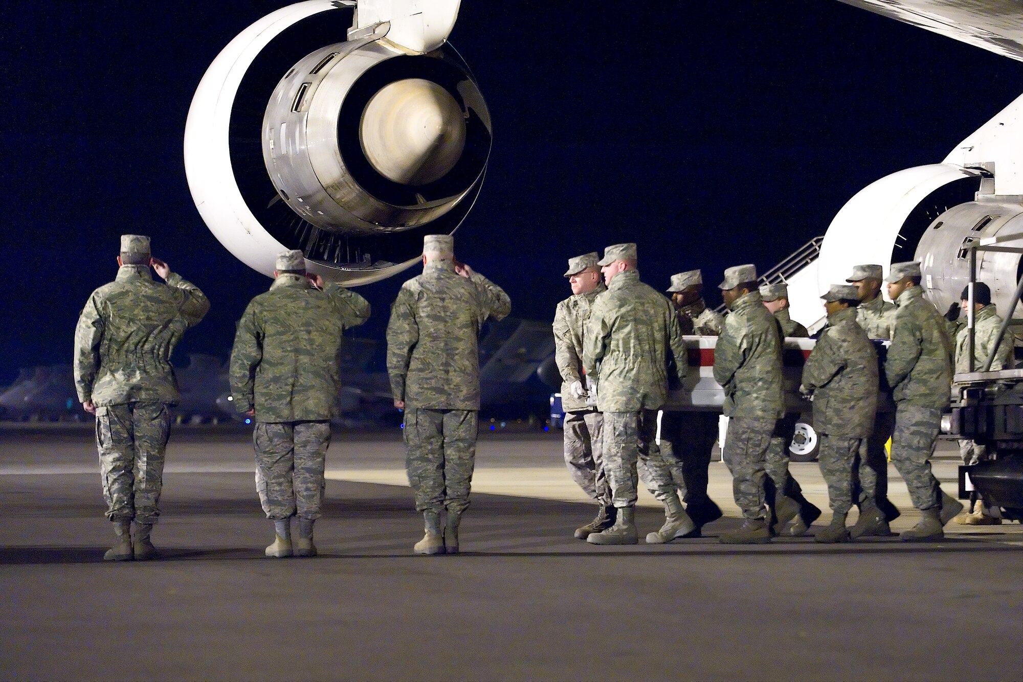 A U.S. Air Force carry team transfers the remains of Air Force Tech. Sgt. Anthony C. Campbell Jr., of Florence, Ky., at Dover Air Force Base, Del., December 16. Tech. Sgt. Campbell was assigned to the 932nd Civil Engineer Squadron, Air Force Reserve, Scott Air Force Base, Ill. Sergeant Campbell Jr., 35, died Dec. 15 of wounds suffered from the detonation of an improvised explosive device in Helmand Province, Afghanistan.  (U.S. Air Force photo/Roland Balik)