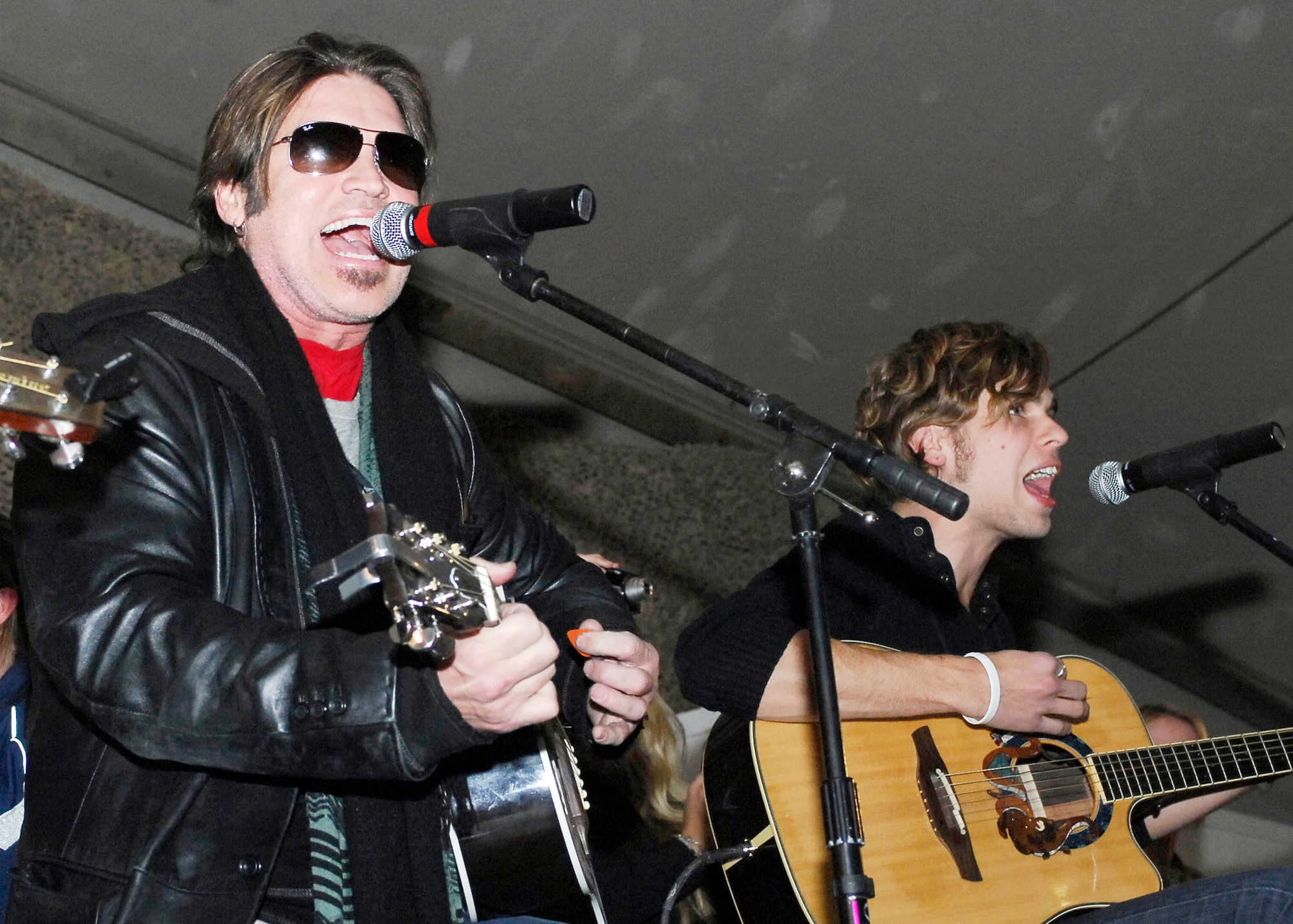 Billy Ray Cyrus, singer/actor, entertains the Airmen, Soldiers, Sailors and Marines at Bagram Airfield during a United Service Organization tour Dec. 15, 2009.  Mr. Cyrus, Dave Attell, Anna Kournikova, and Nick Bollettieri attended the USO tour to boost the morale of the servicemen and women.  Mrs. Kournikova is a tennis pro originally from Russia and now lives in Miami, Fla.  Mr. Attell, a comedian, is originally from Queens, N.Y.  Mr. Cyrus hails from Flatwoods, Ky.  Mr. Bollettieri, tennis coach/motivational speaker and hails from Pelham, N.Y. (U.S. Air Force photo/Senior Airman Felicia Juenke)