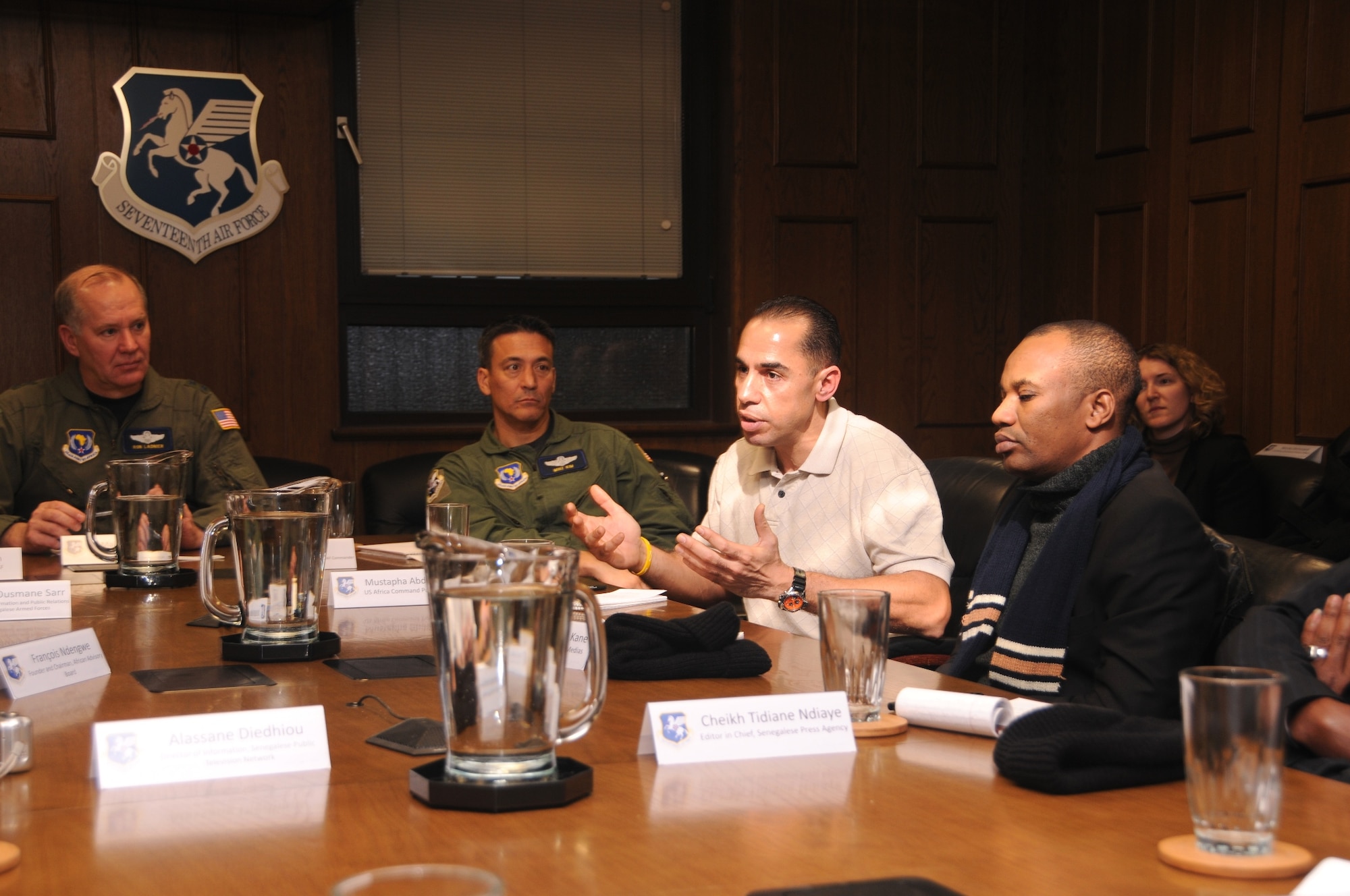 RAMSTEIN AIR BASE, Germany -- Mr. Moses Abdeddine, U.S. Africa Command Public Affairs (center), translates for members of 17th Air Force and members of the Senegalese press corps at the unit's headquarters Dec. 16. (From left to right) Maj. Gen. Ron Ladnier, 17th Air Force commander, Col. Mike Kim, mobilization assistant, Mr. Mamaoudou Ibra Kane, RFM Radio, and Ms. Nicole Dalrymple, U.S. Africa Command PA, take part in the exchange. The group was engaged in a round-table discussion as the delegation visited 17th, the air component for U.S. Africa Command. (USAF photo by Master Sgt. Jim Fisher)