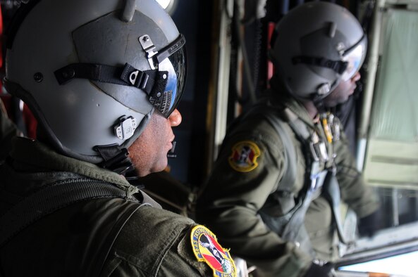 POHNPEI - Master Sgt. Anthony Pembevton and Tech. Sgt. Jerron Ashley, 36th Airlift Squadron loadmasters, prepare to unload a box of donated aid in support of Operation Christmas Drop Dec. 17. The operation, which began in 1952, is the Air Force?s longest-running humanitarian mission. Airmen today continue the tradition delivering supplies to remote islands of the Commonwealth of the Northern Marianas Islands, Yap, Palau, Chuuk and Pohnpei.   (U.S. Air Force Photo by Airman 1st Class Julian North)