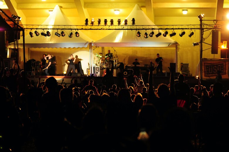 ANDERSEN AIR FORCE BASE, Guam - Fans cheer on Craig Morgan as he plays his encore "International Harvester" for fans during his concert here Dec. 15  Craig Morgan, one of country music artists and an Army veteran, is visiting, entertaining and kicking off the holidays with troops and their families stationed in Guam and Okinawa as part of a week-long USO/Armed Forces Entertainment tour. (U.S. Air Force photo by Airman 1st Class Courtney Witt)
