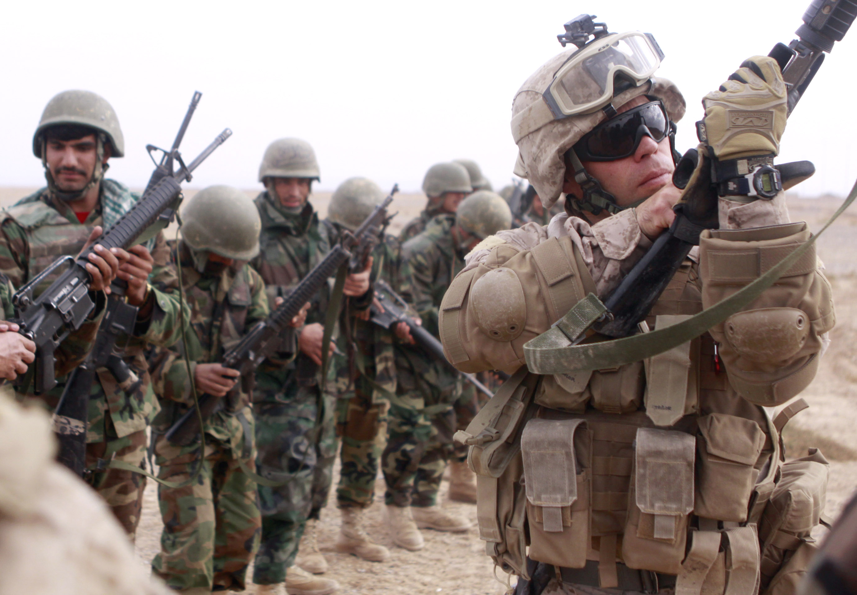 Marine Corps Gunnery Sgt. Steven J. Taylor inspects the chamber of an ...