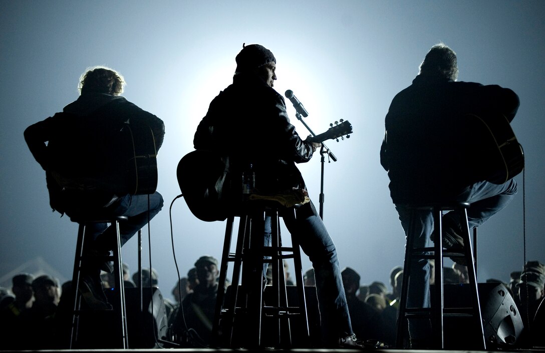 Musician Billy Ray Cyrus performs during the 2009 USO Holiday Tour stop in Kandahar, Afghanistan, Dec. 17, 2009. 