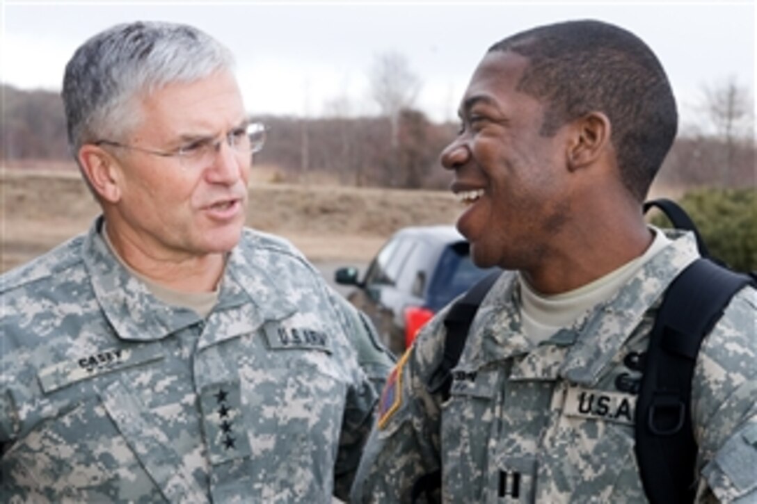 Chief of Staff of the Army Gen. George W. Casey Jr. and Capt. Johnson talk at Camp Higashi-Chitose, Japan, on Dec. 16, 2009.  Casey visited U.S. soldiers in Japan to thank them for their service and to wish them happy holidays.  