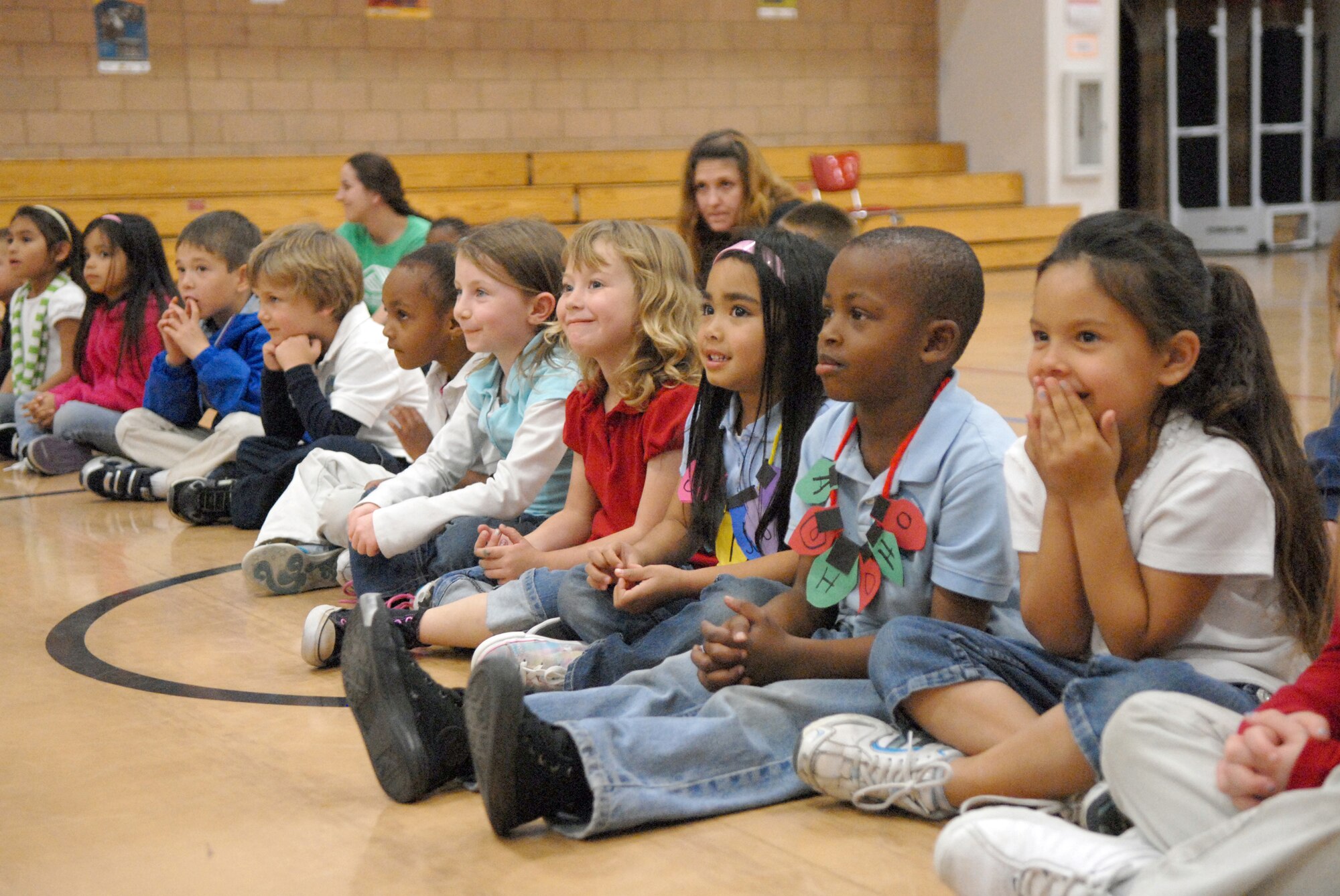 VANDENBERG AIR FORCE BASE, Calif. -- Children from the school-age daycare class at the Youth Center here enjoy the musical entertainment provided by the Band of the Golden West from Travis AFB, Calif.,Thursday, Dec. 17, 2009. The band toured main base and played holiday songs for members of Vandenberg. (U.S. Air Force photo/Airman 1st Class Kerelin Molina)