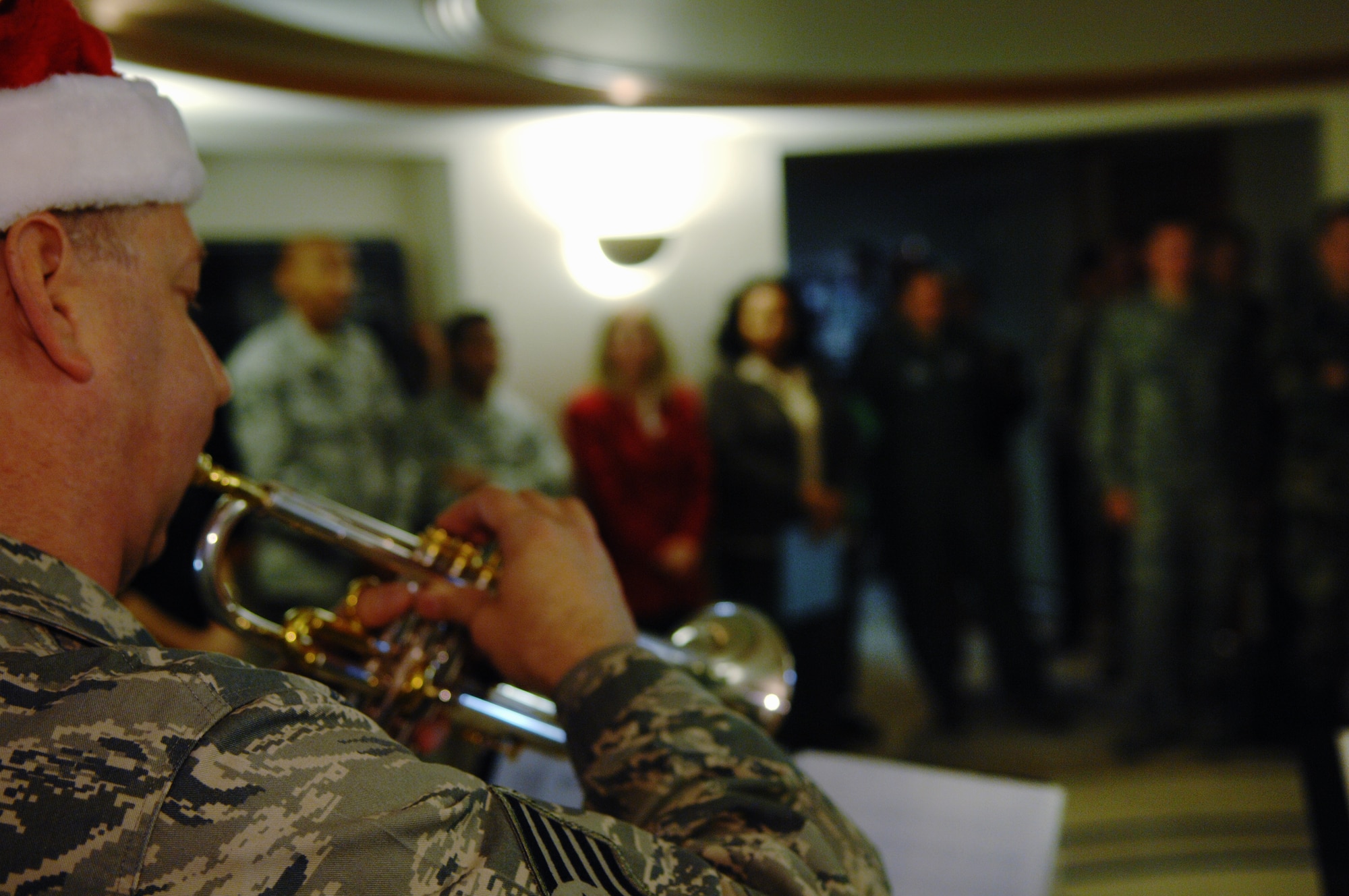 VANDENBERG AIR FORCE BASE, Calif. -- Tech. Sgt. Edward Schubert, a member of the Band of the Golden West from Travis AFB, Calif., plays Christmas carols at the 30th Space Wing headquarters Thursday, Dec. 17, 2009, here. The band toured main base and played Christmas songs to members of Vandenberg. (U.S. Air Force photo/Staff Sgt. Levi Riendeau)