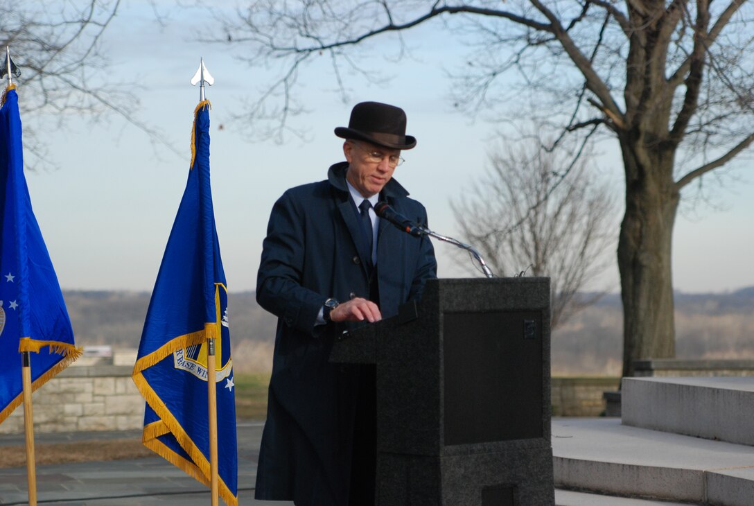 After donning a costume reminiscent of the turn of the century, Brig. Gen. Paul Sampson tells the story of Dayton, Ohio's most famous inventors, Wilbur and Orville Wright, during a ceremony Dec. 17, 2009, at Wright-Patterson Air Force Base, Ohio. The general was keynote speaker for a ceremony marking the 106th anniversary of the Wright brothers' first powered flight. Brig. Gen. Sampson is mobilization assistant to the commander of Aeronautical Systems Center. (U.S. Air Force photo/Bonnie White)