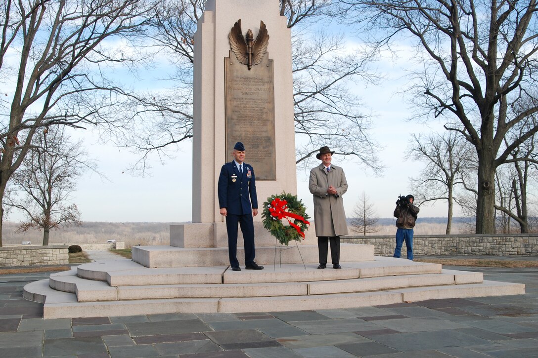 Col. Brad Spacy and Stephen Wright place a wreath at the Wright Brothers Memorial overlooking Wright-Patterson Air Force Base, Ohio, on Dec. 17, 2009, during a ceremony marking the 106th anniversary of the Wright brothers' first powered flight.  Mr. Wright is the Wright brothers' great grand-nephew and Colonel Spacy is 88th Air Base Wing commander. (U.S. Air Force photo/Bonnie White)