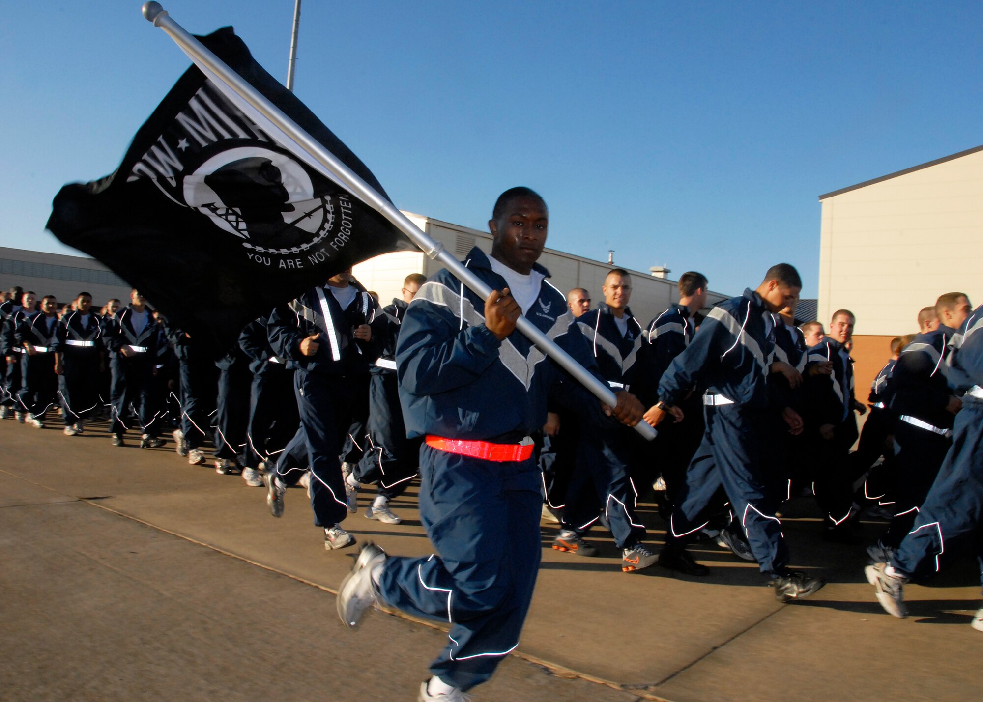 The Prisoner of War and MIA flag was carried during the Wing Run Dec. 17 in honor of those servicemembers who were held captive or haven’t come home. The entire 82nd Training Wing ended this year’s Wingman Day by participating in a 3-mile run around the base. (U.S. Air Force photo/Mike Litteken)
