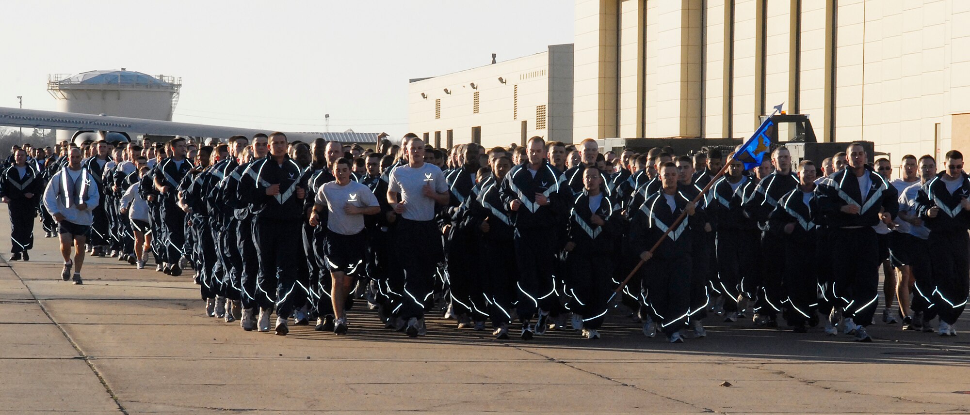 Airmen run in formation by group during the Wing Run Dec. 17. The entire 82nd Training Wing ended this year’s Wingman Day by participating in a 3-mile run around the base. (U.S. Air Force photo/Mike Litteken)