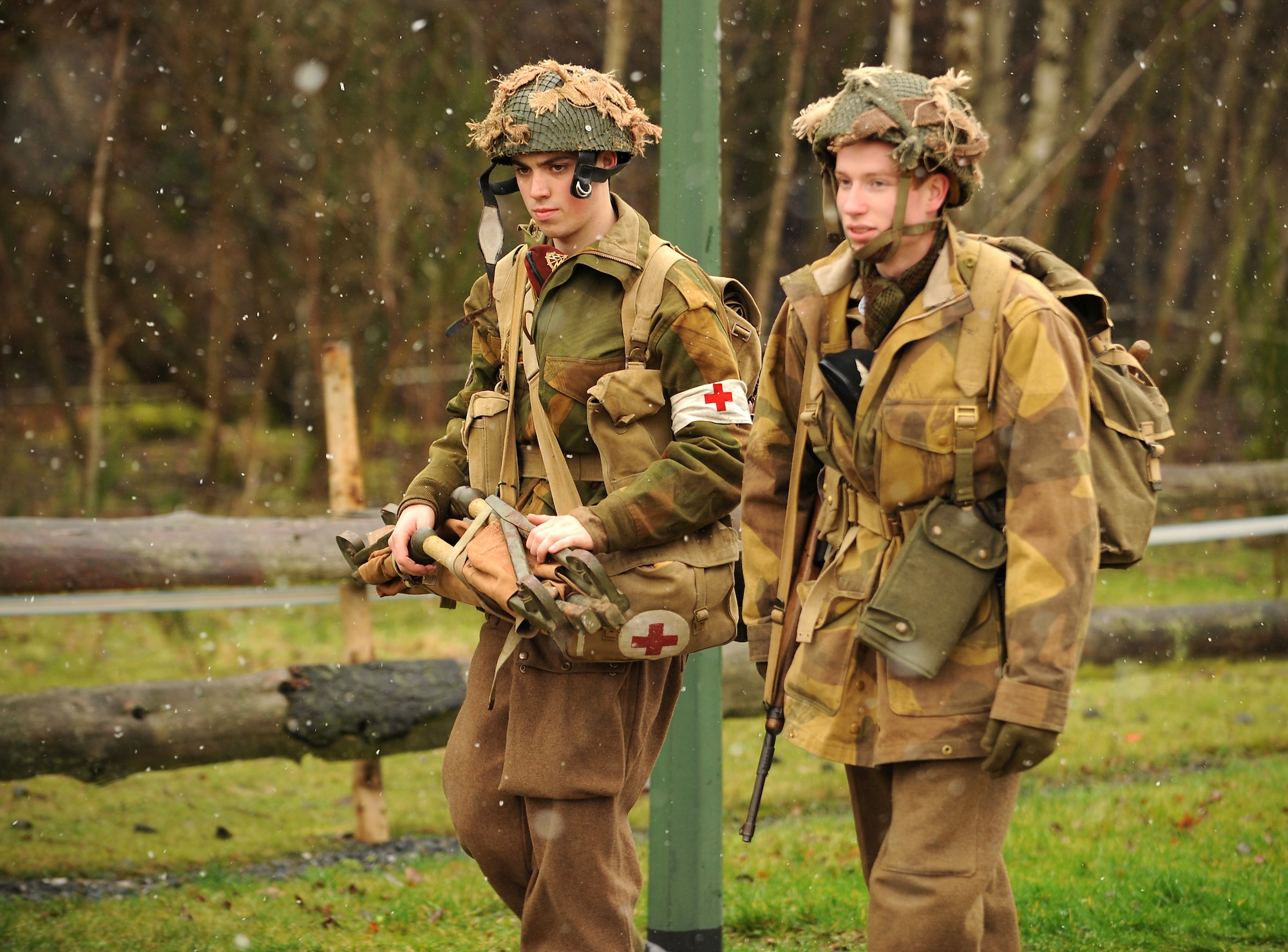 World War II re-enactors walk along a trail Dec. 12, 2009, during the 32nd Bastogne Historic Walk here in Bastogne, Belguim. Despite the snow and cold, more than 4,500 people from across Europe and the world participated in the event. (U.S. Air Force photo/Airman 1st Class Nathanael Callon)
