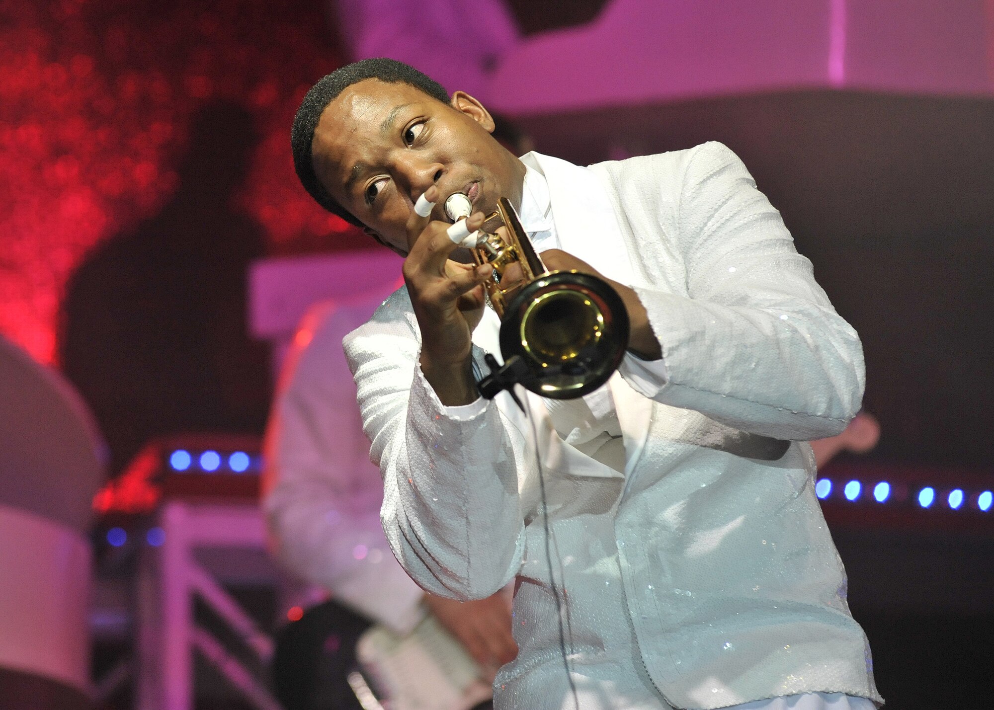 Senior Airman Anthoney Williams, a fire protection apprentice with the 35th Civil Engineer Squadron at Misawa Air Base, Japan, entertains the crowd with a trumpet solo Dec. 10 during the Tops In Blue performation at the Four Seasons Arena. (U.S. Air Force photo/John Turner)