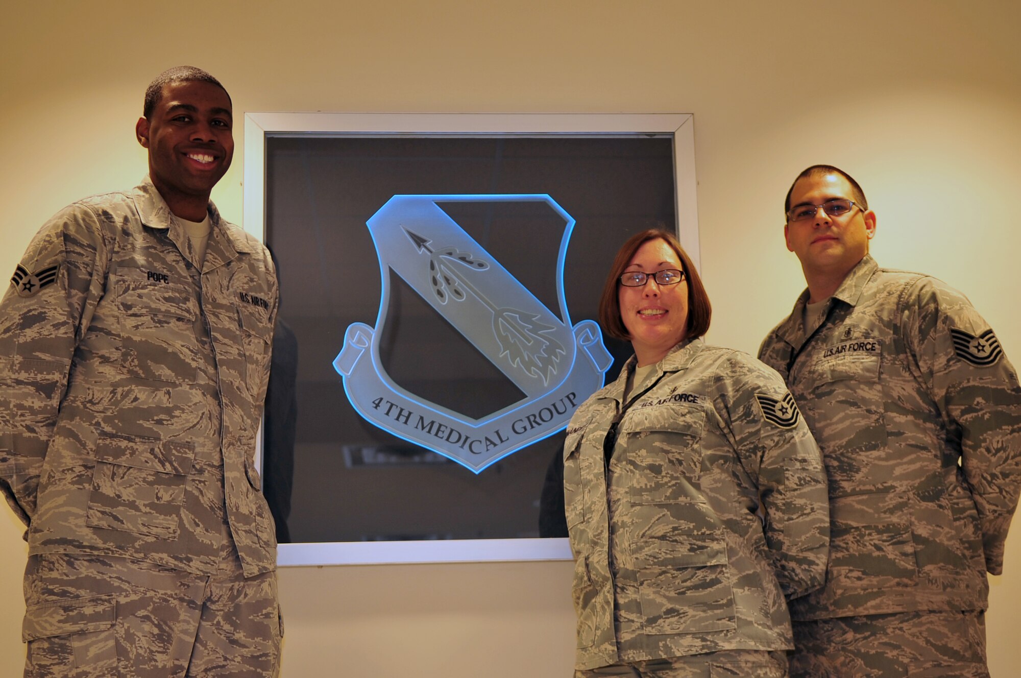 Senior Airman Johnnie Pope, and Tech. Sgts. Christina and Christopher Hernandez aided victims involved in a vehicle accident near Seymour Johnson Air Force Base, N.C., Dec. 18, 2009. The act of stopping on the side of the road, in near-freezing temperatures displayed the selflessness embedded in Seymour Johnson Airmen during the holiday season and throughout the rest of the year. Airmen Pope is from the 4th Medical Support Squadron, and Sgts. Christina and Christopher Hernandez are from the 4th Aerospace Medical Squadron. (U.S. Air Force photo/Airman 1st Class Rae Perry)