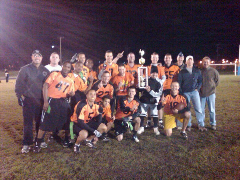 VANDENBERG AIR FORCE BASE, Calif. -- The 30th Operations Group intramural flag football team poses with the championship trophy after shutting out the 30th Force Support Squadron Services team in two games, 17-0 and 21-0. After these wins, the 30th OG's season record is 16-1. (Courtesy photo)