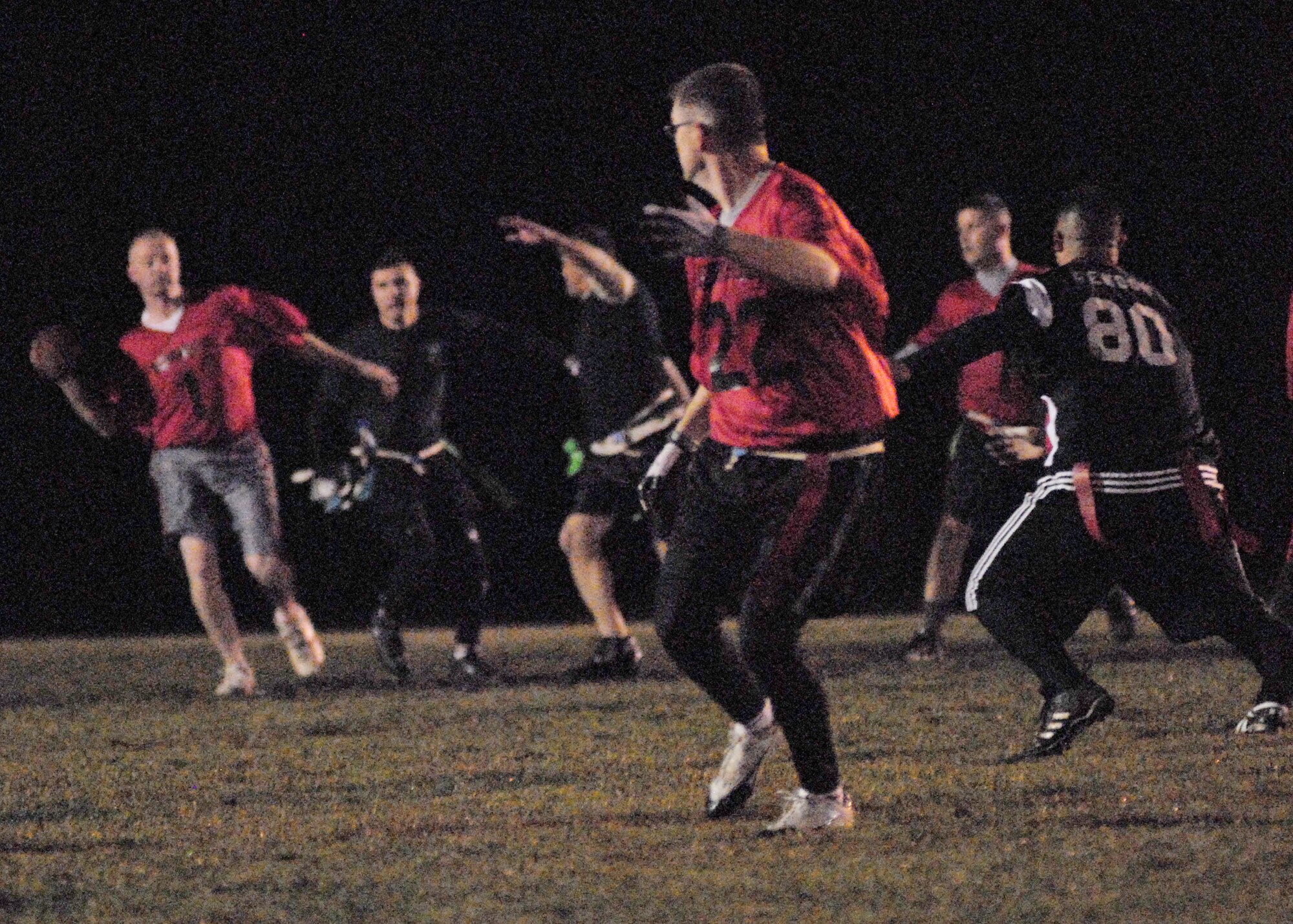VANDENBERG AIR FORCE BASE, Calif. -- Jace Pape, a member of 532nd Training Squadron team, prepares to throw the football to an open receiver during round one of the losers’ bracket playoff game Tuesday, Dec. 15, 2009, here. The 30th SFS won the match-up 21-6. (U.S. Air Force photo/Airman 1st Class Kerelin Molina)