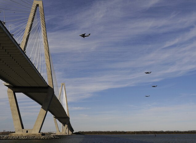 U.S. Air Force C-17 aircraft pass over the Arthur Ravenel Jr. Bridge in Charleston, S.C., Dec. 16, 2009. Charleston AFB conducted a large formation exercise utilizing 10 C-17 aircraft. During the exercise U.S. Army Soldiers from the 2-319th Airborne Field Artillery, 82nd Airborne Division, Ft. Bragg, N.C., were airdropped along with cargo pallets to simulate the seizure of a remote airfield.(U.S. Air Force photo/Tech. Sgt. Sean Worrell)(Released)