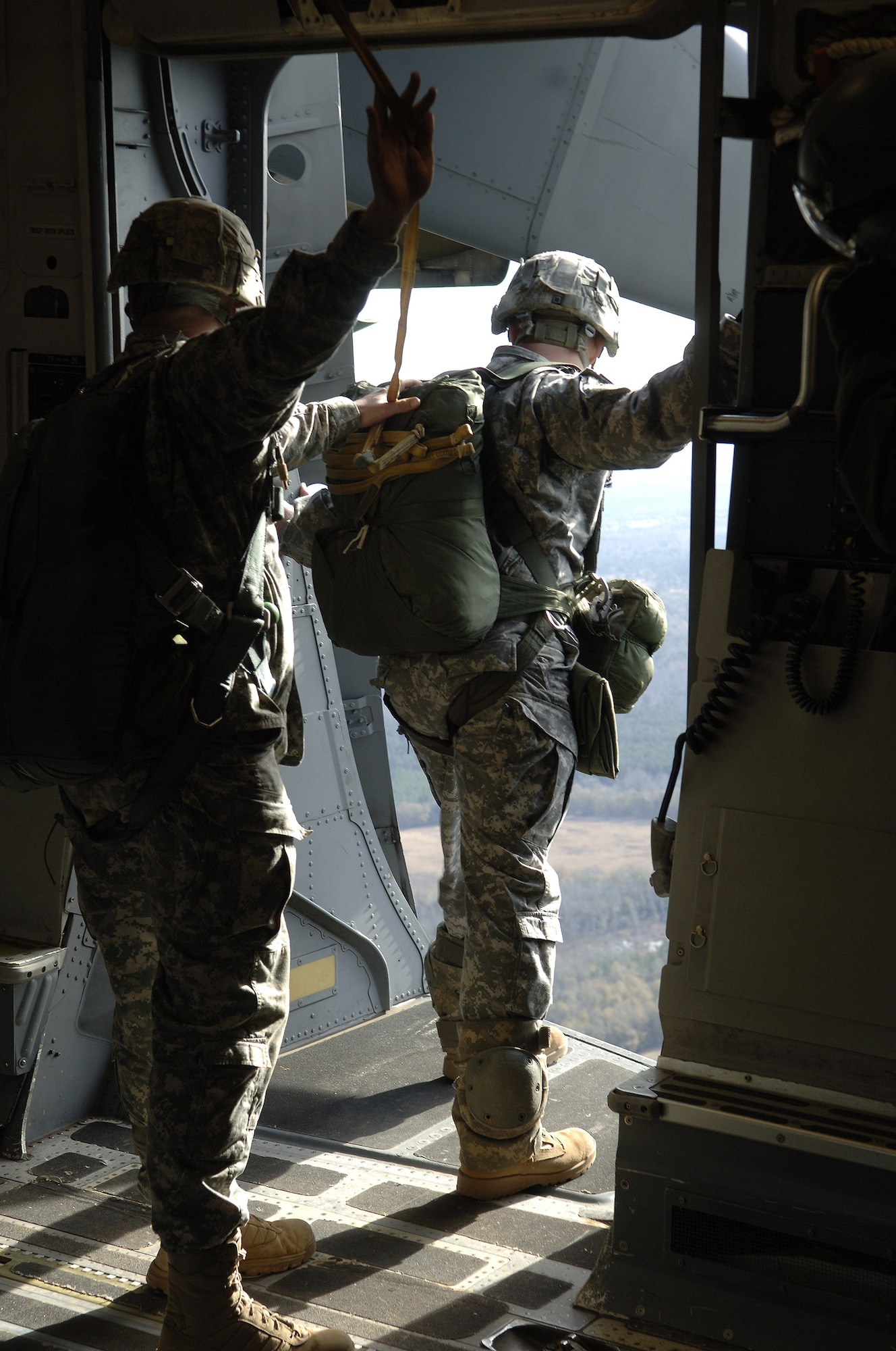 Soldiers with the 82nd Airborne Division, Ft. Bragg, N.C., prepare to jump from a Charleston Air Force Base C-17 during a strategic brigade airdrop exercise over North Auxiliary Airfield near North, S.C., Dec. 16, 2009. The soldiers jumped along with 58 others and several pallets of equipment to simulate the seizure of a remote field. Ten Charleston AFB C-17s were utilized during the mission. (U.S. Air Force photo/Airman 1st Class Lauren Laidlaw)