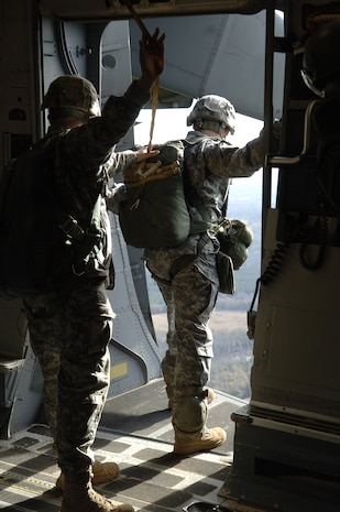 Soldiers with the 82nd Airborne Division, Ft. Bragg, N.C., prepare to jump from a Charleston Air Force Base C-17 during a strategic brigade airdrop exercise over North Auxiliary Airfield near North, S.C., Dec. 16, 2009. The soldiers jumped along with 58 others and several pallets of equipment to simulate the seizure of a remote field. Ten Charleston AFB C-17s were utilized during the mission. (U.S. Air Force photo/Airman 1st Class Lauren Laidlaw)