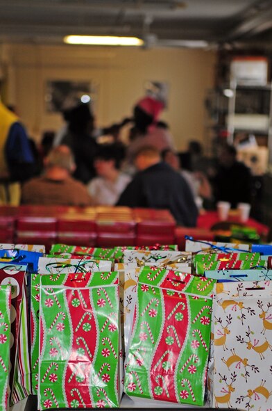 BARKSDALE AIR FORCE BASE, La. -- Clients of the Handicapped Are Producers House eat lunch and socialize prior to opening their Christmas presents during their holiday party, Dec. 11. The Barksdale Officer's Spouses Club raised funds to help give the men and women of HAP House a break to enjoy the holiday season. (U.S. Air Force photo by Senior Airman Joanna M. Kresge)